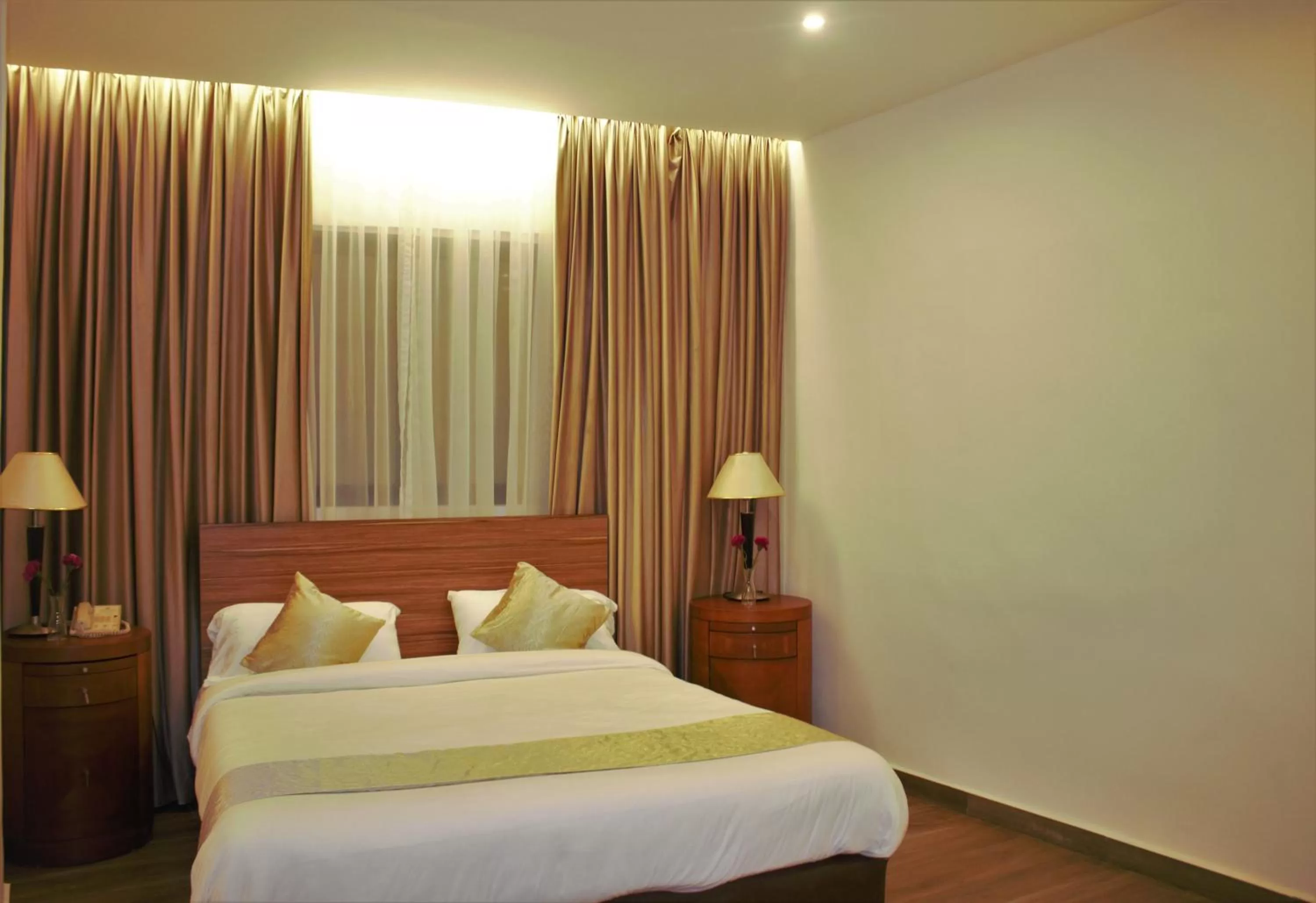 Bed in New MerryLand Hotel