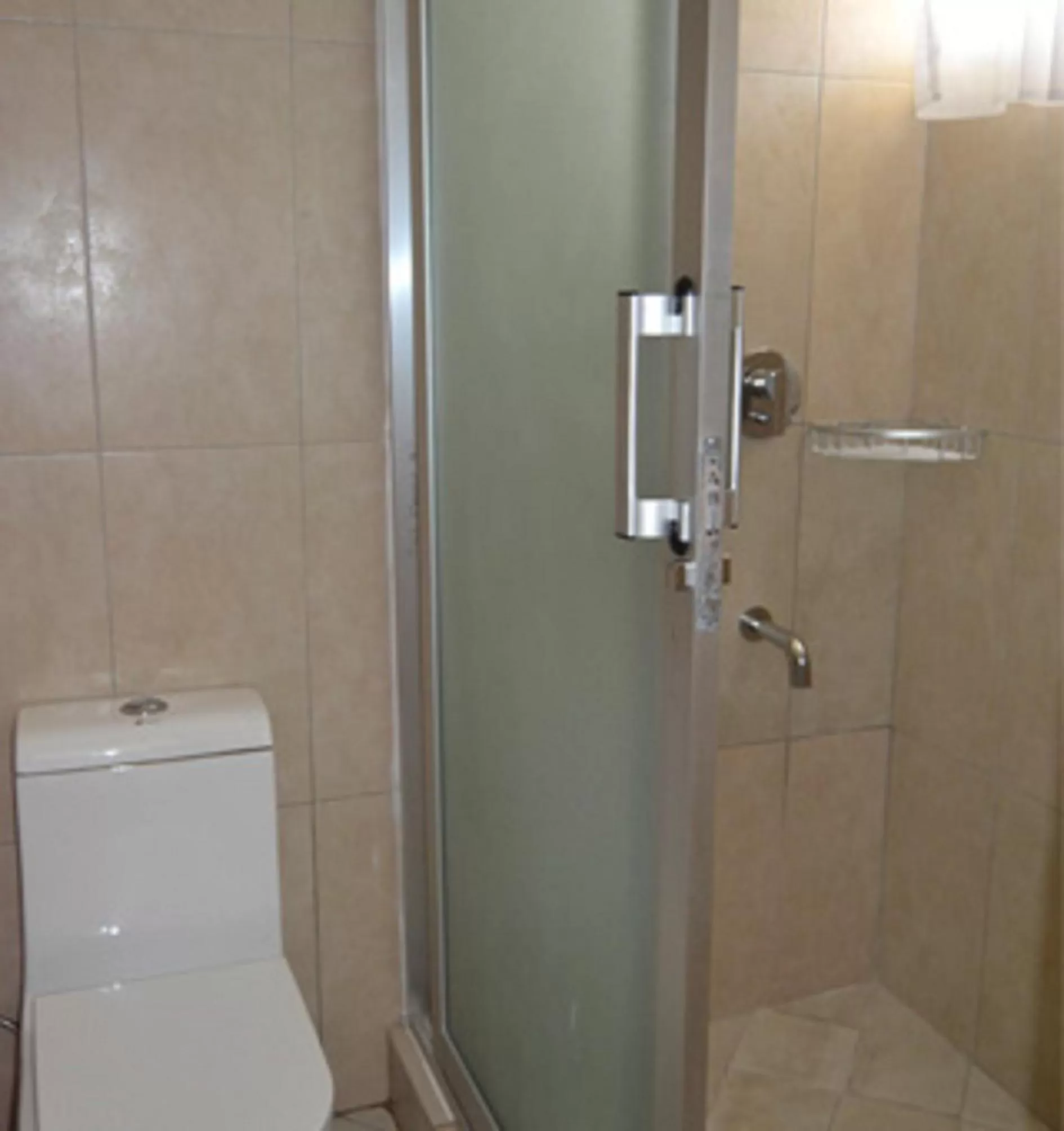 Toilet, Bathroom in Serene Beach Resort