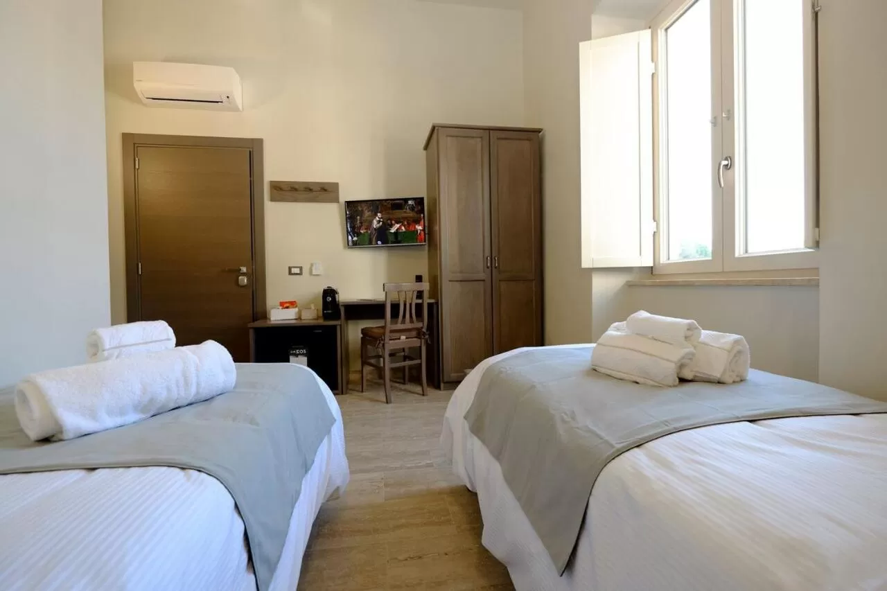 Photo of the whole room, Bed in EOS Room and Breakfast