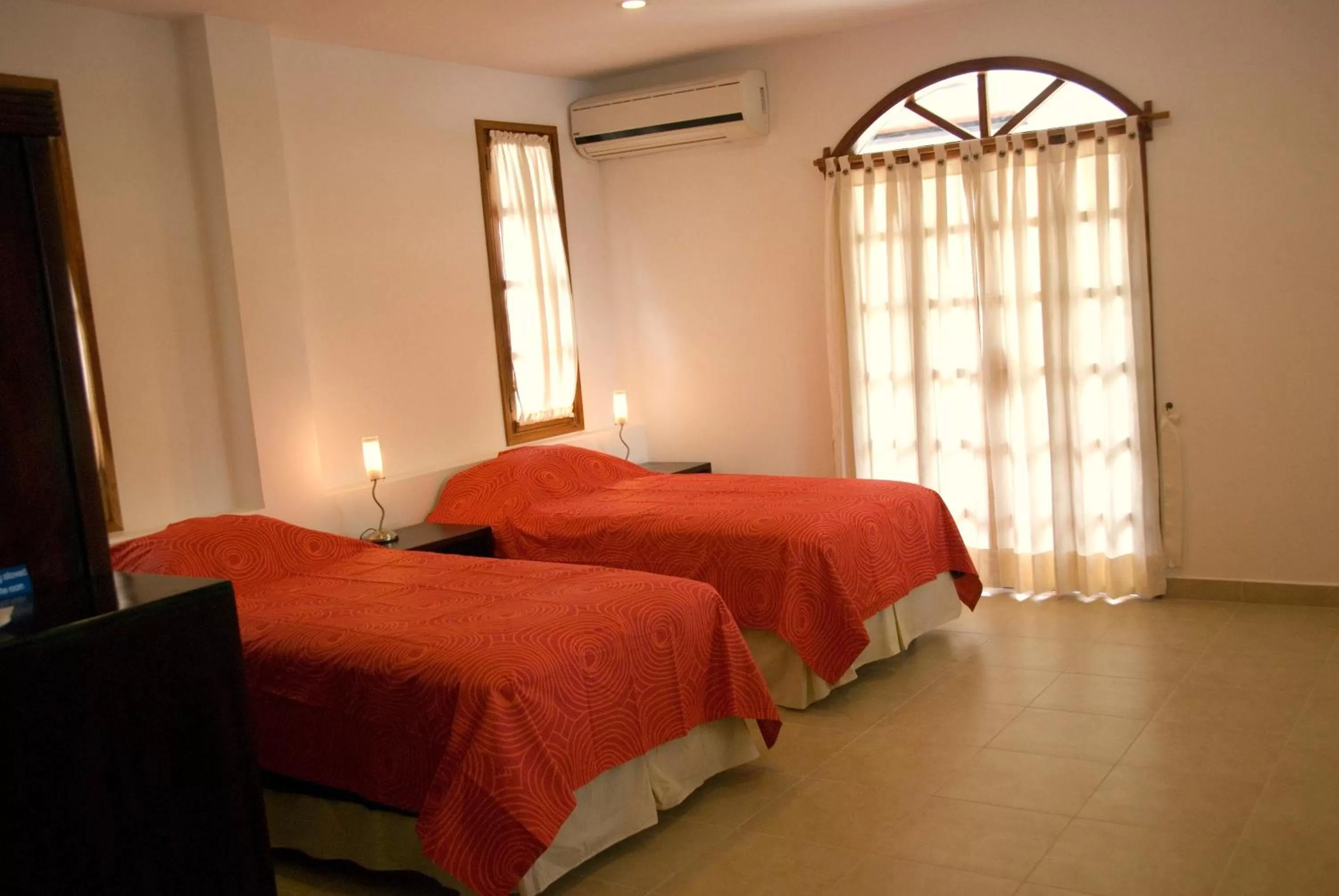 Bed in Hotel Galapagos Suites B&B