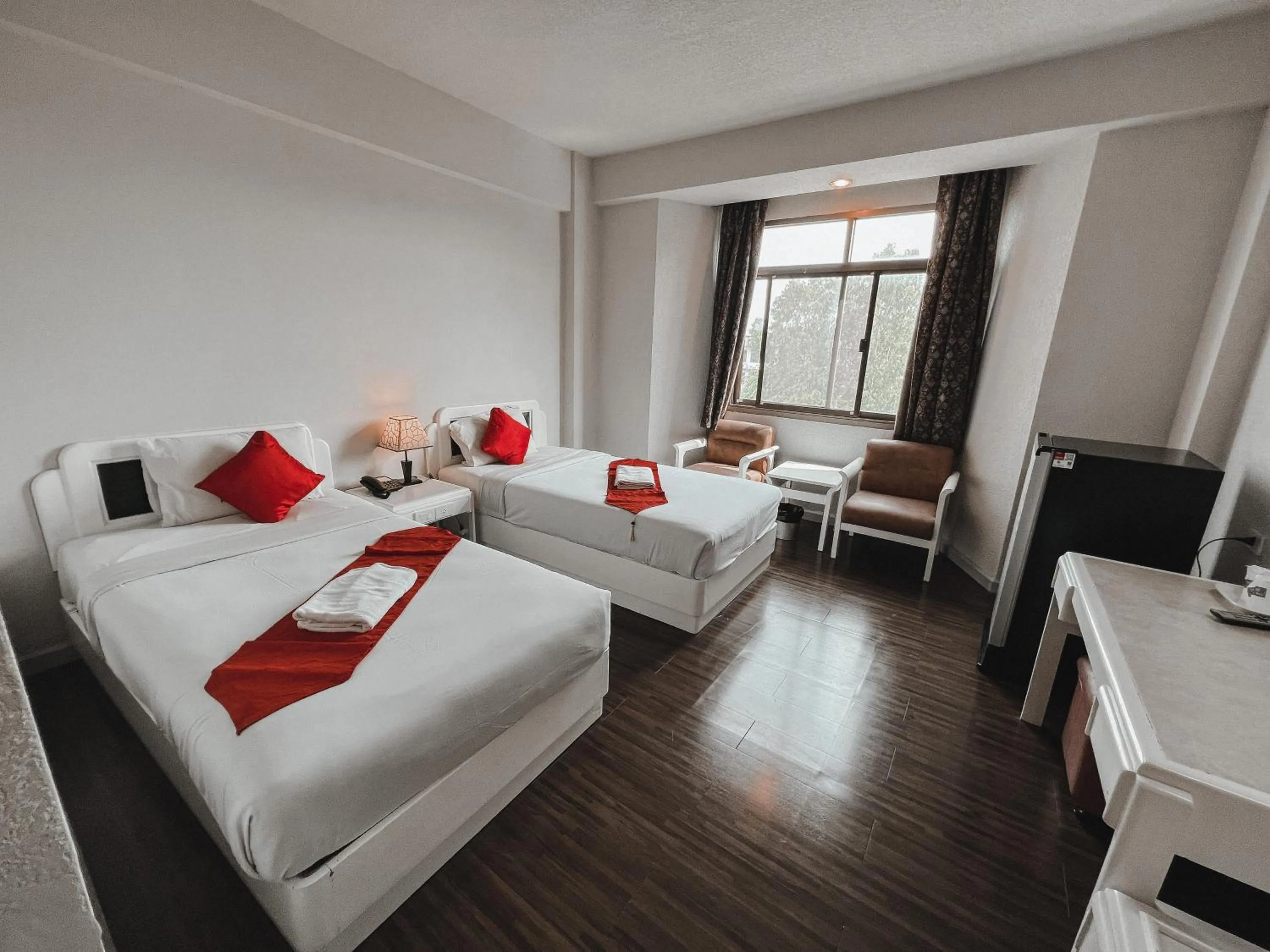 Photo of the whole room, Bed in River Grand Hotel