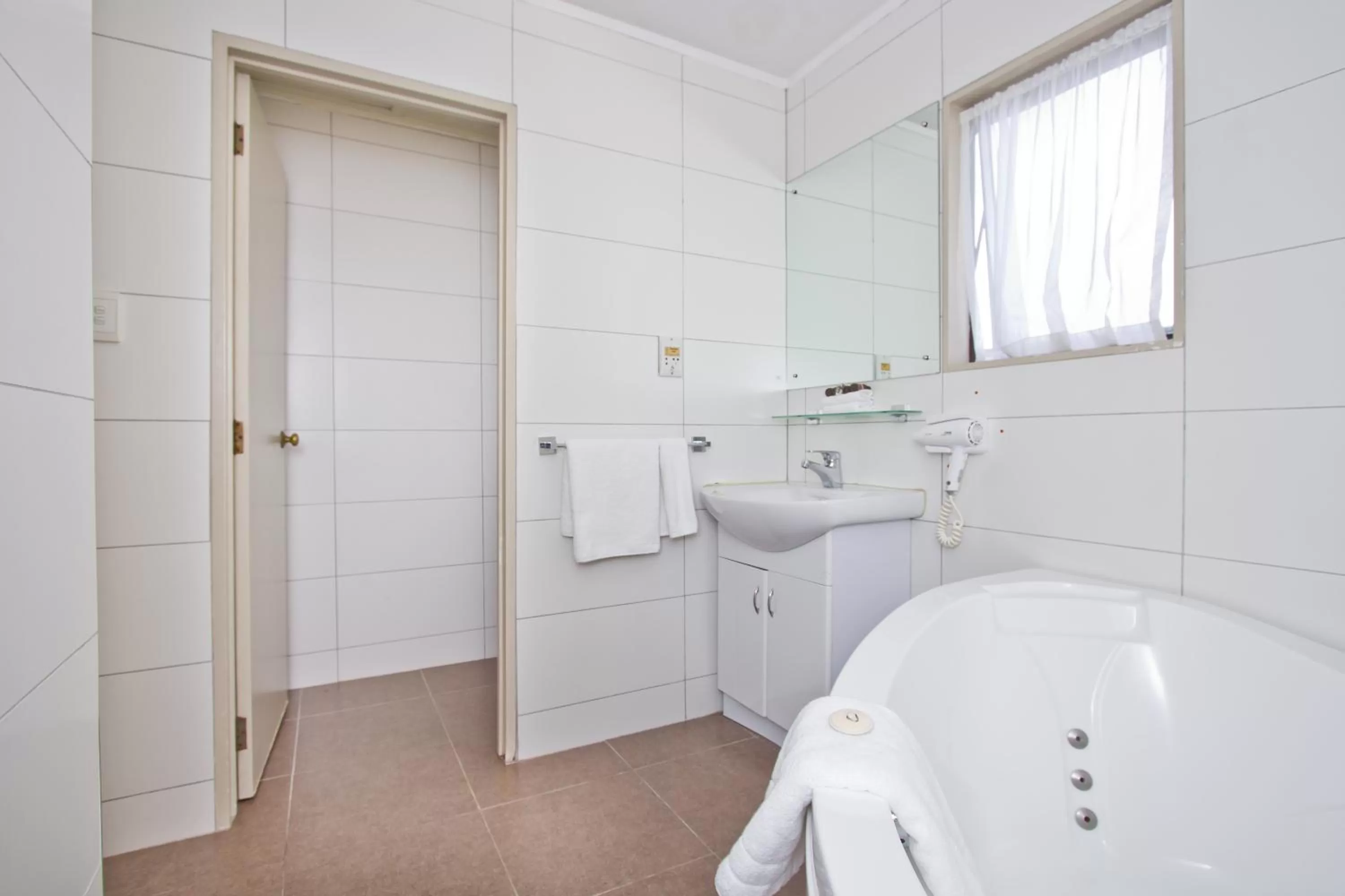 Bathroom in Airport Manor Inn