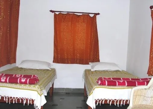 Photo of the whole room, Bed in Udai Haveli Guest House