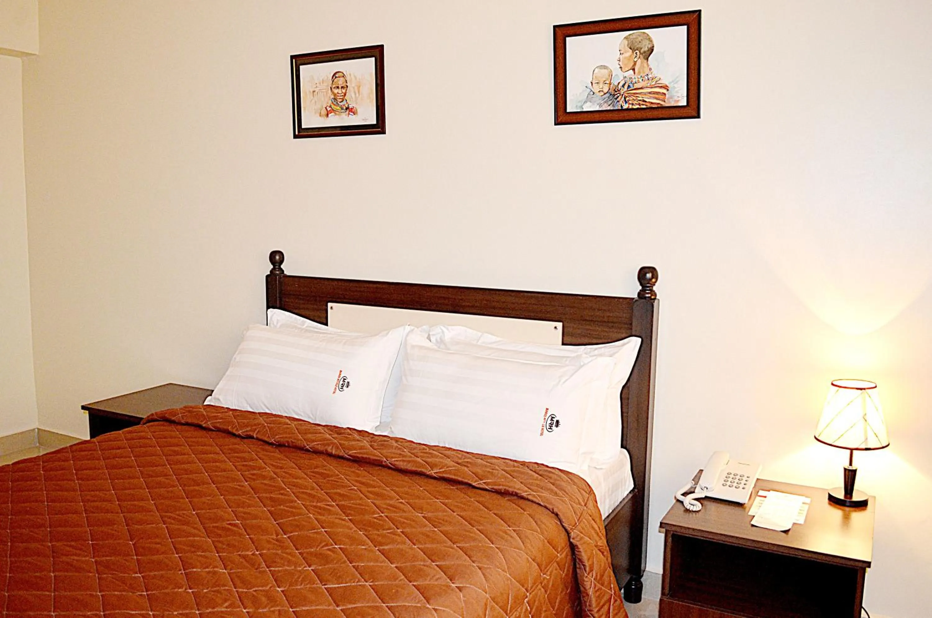 Bed in Marie's Royale Hotel