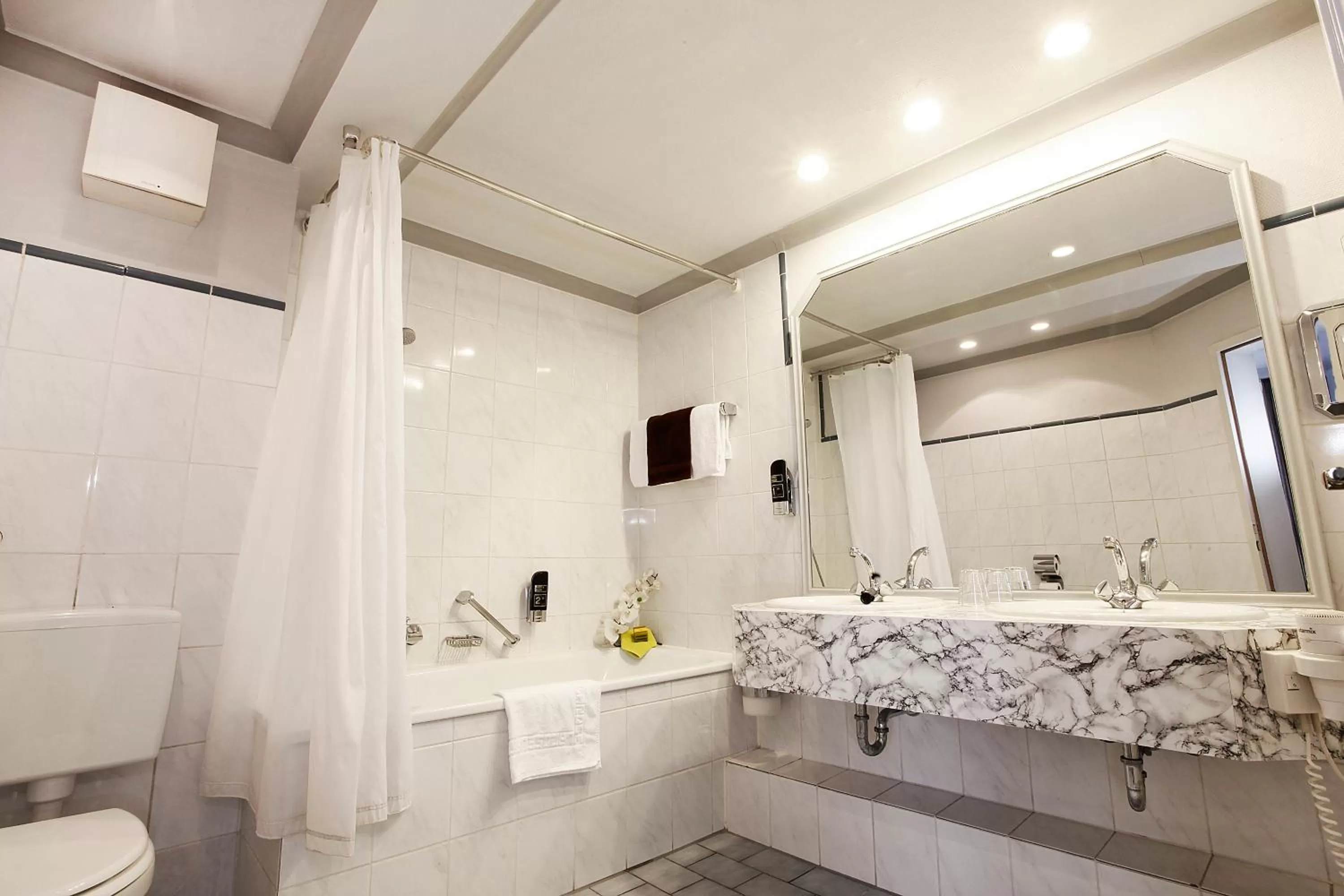 Bathroom in INA Hotel Royal