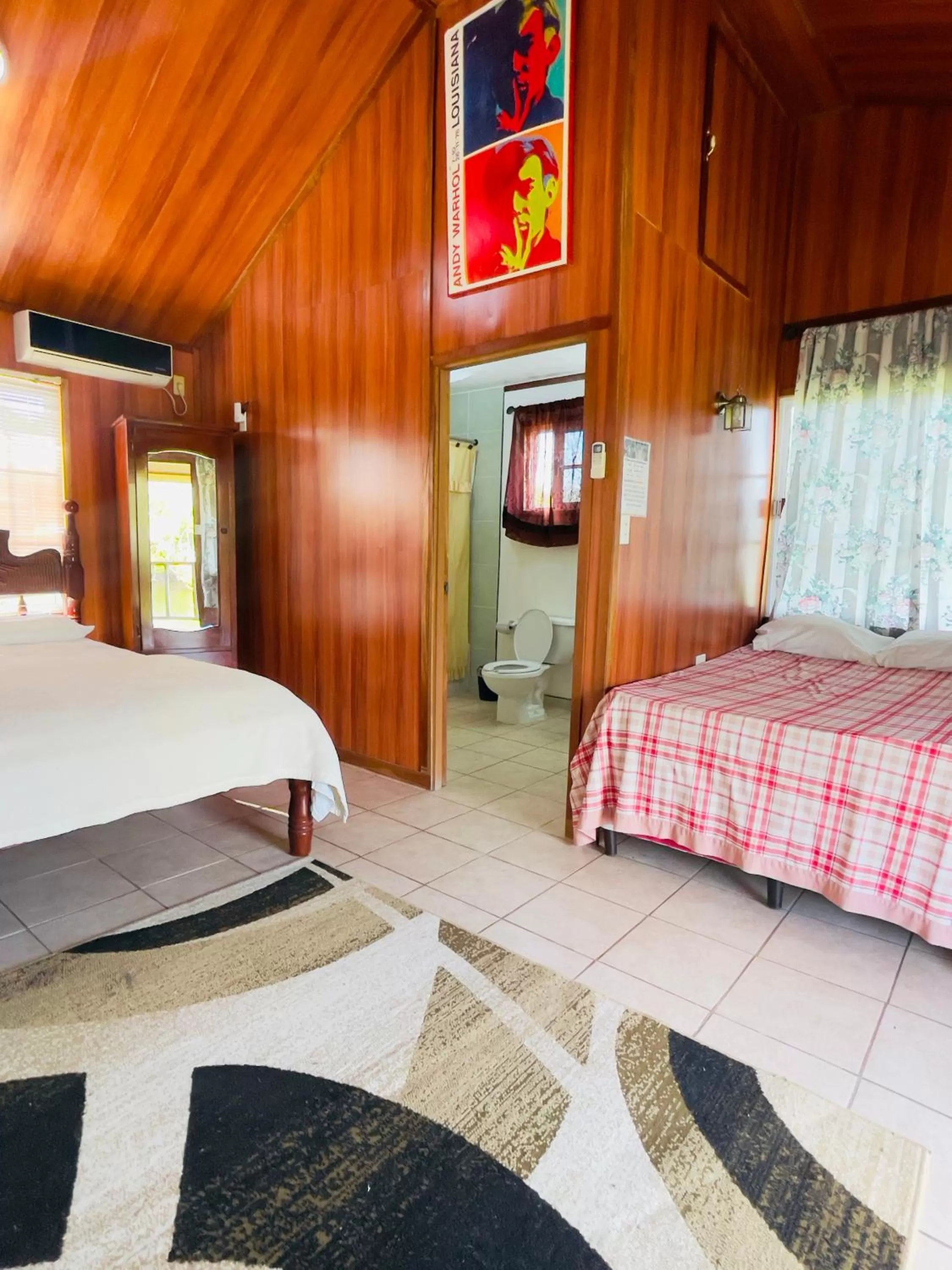 Bed in Lamanai Riverside Retreat