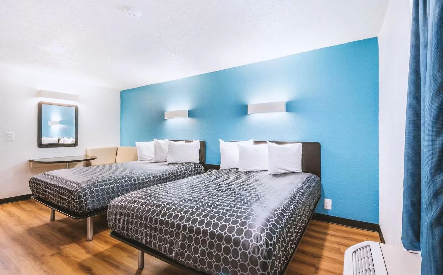 Bed in Sky Palace Inn & Suites By Jasper Beeville