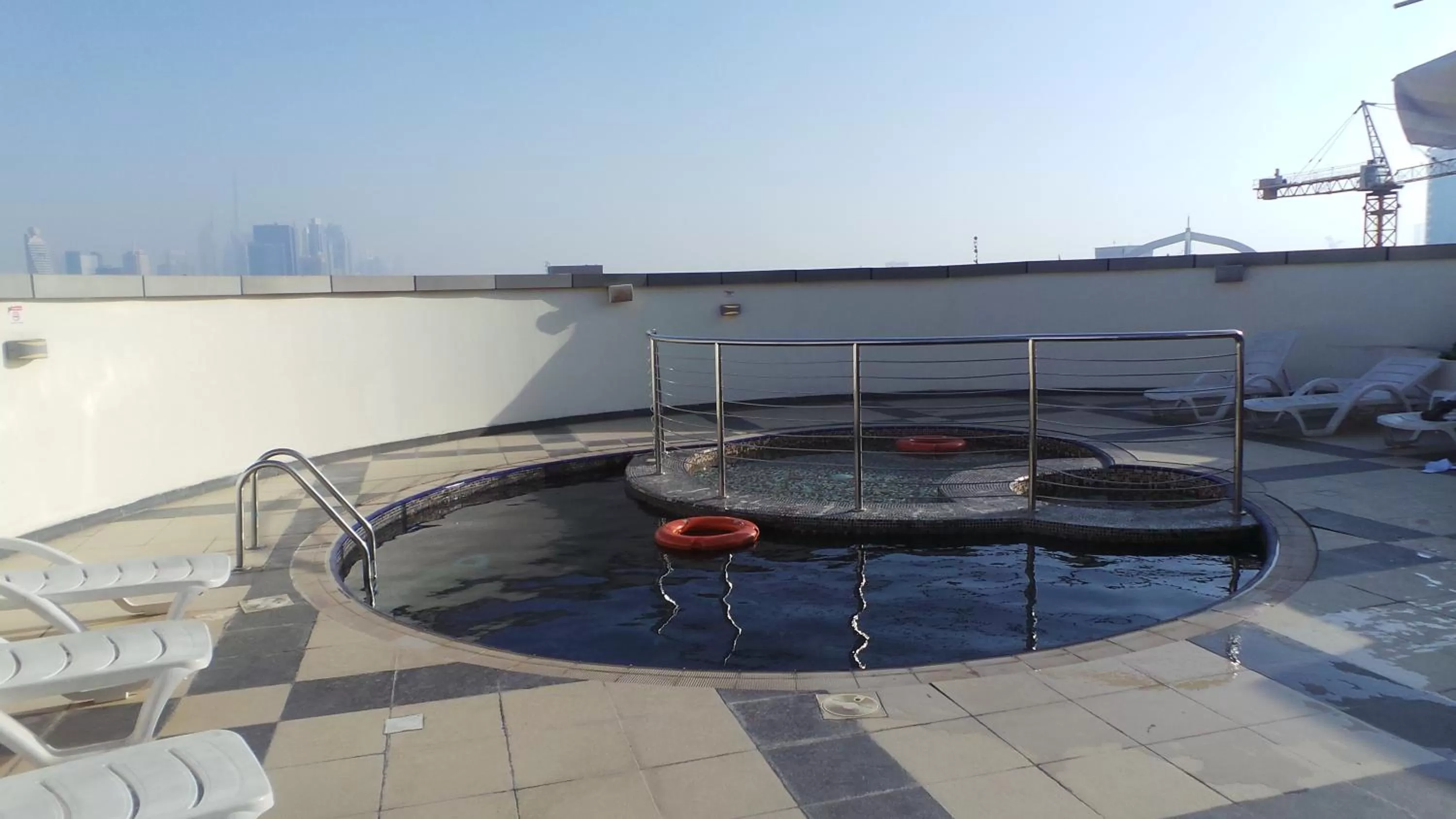 Swimming pool in Xclusive Maples Hotel Apartment