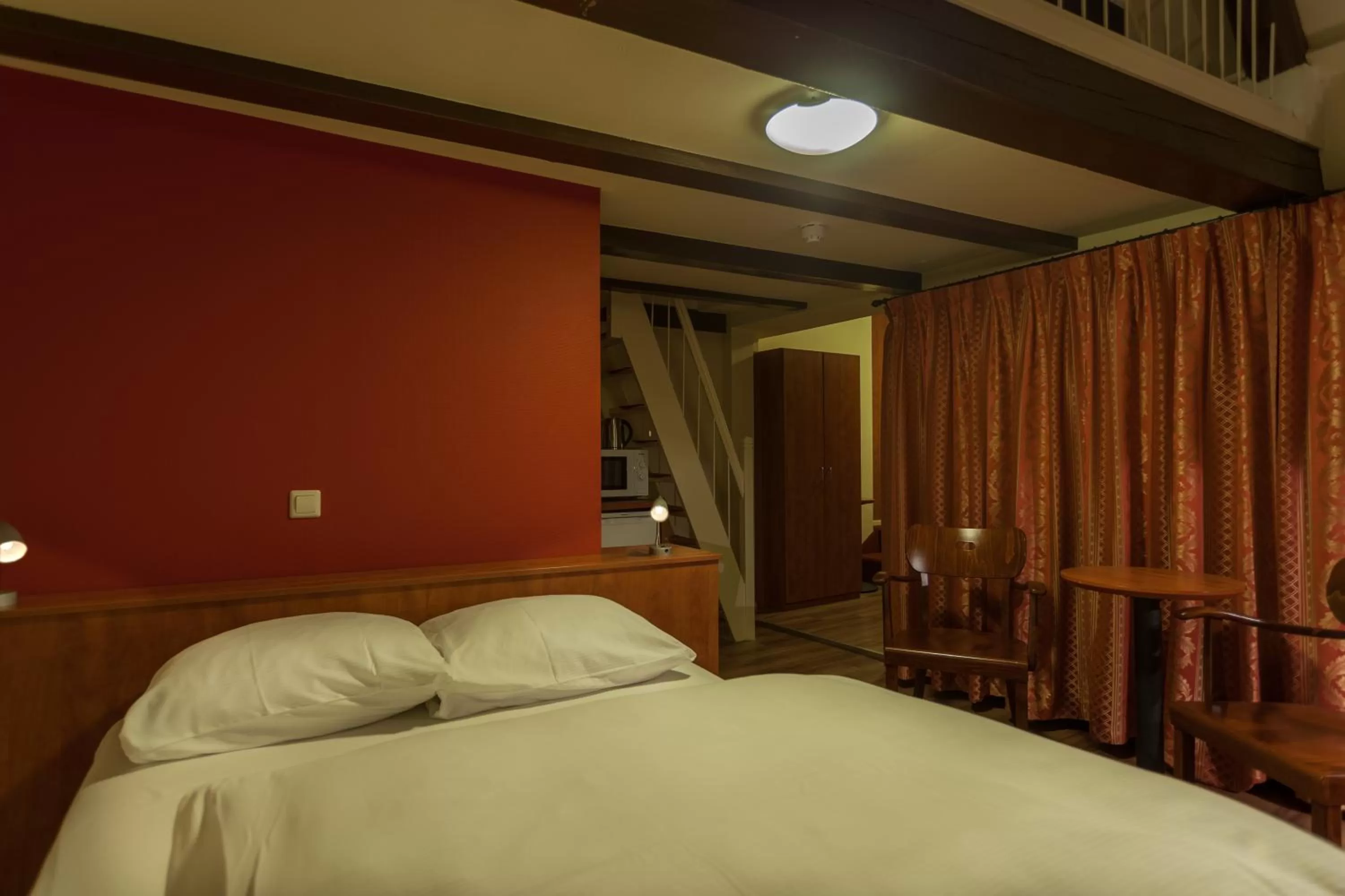 Bed in A-Train Hotel