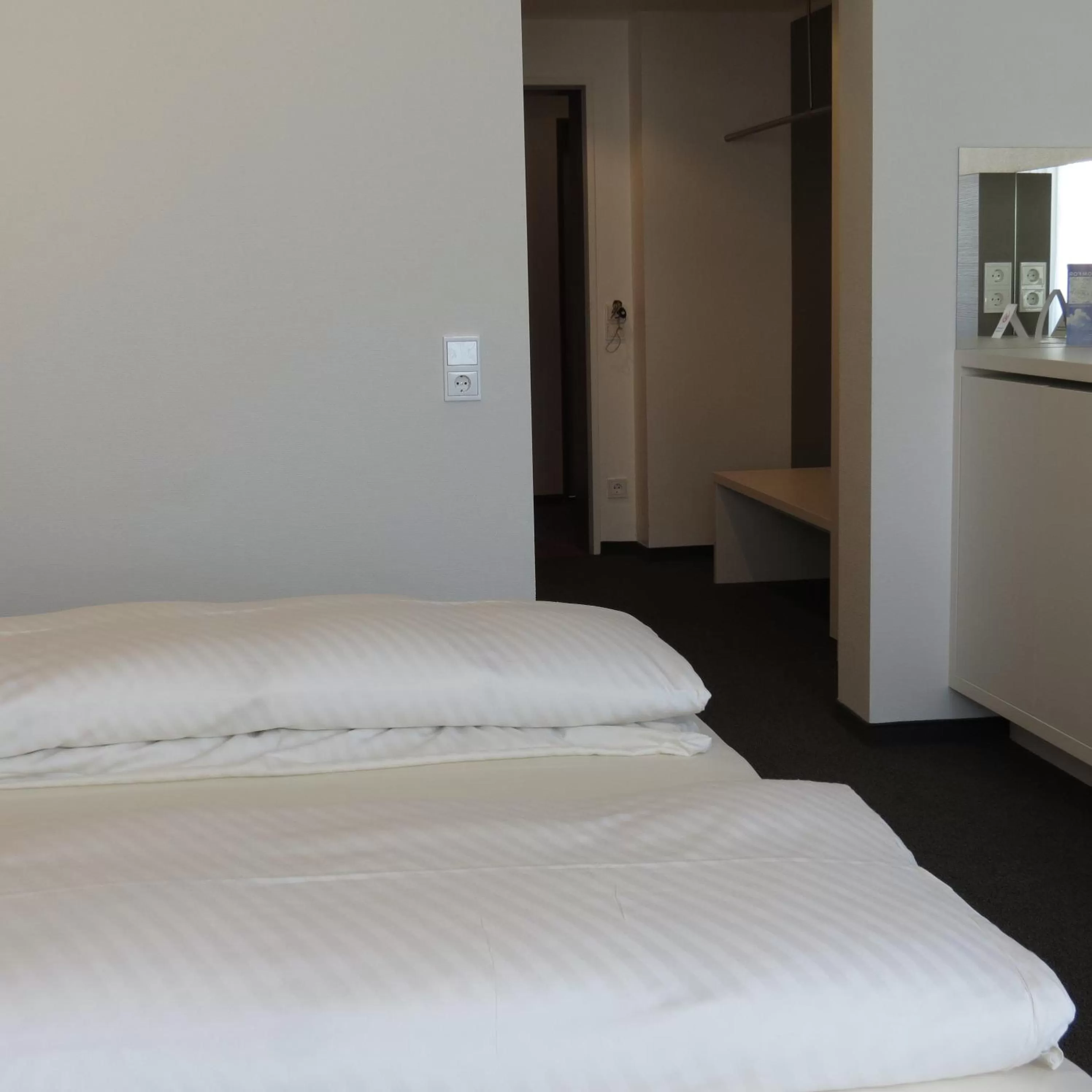 Bed in Comfor Hotel Ulm City