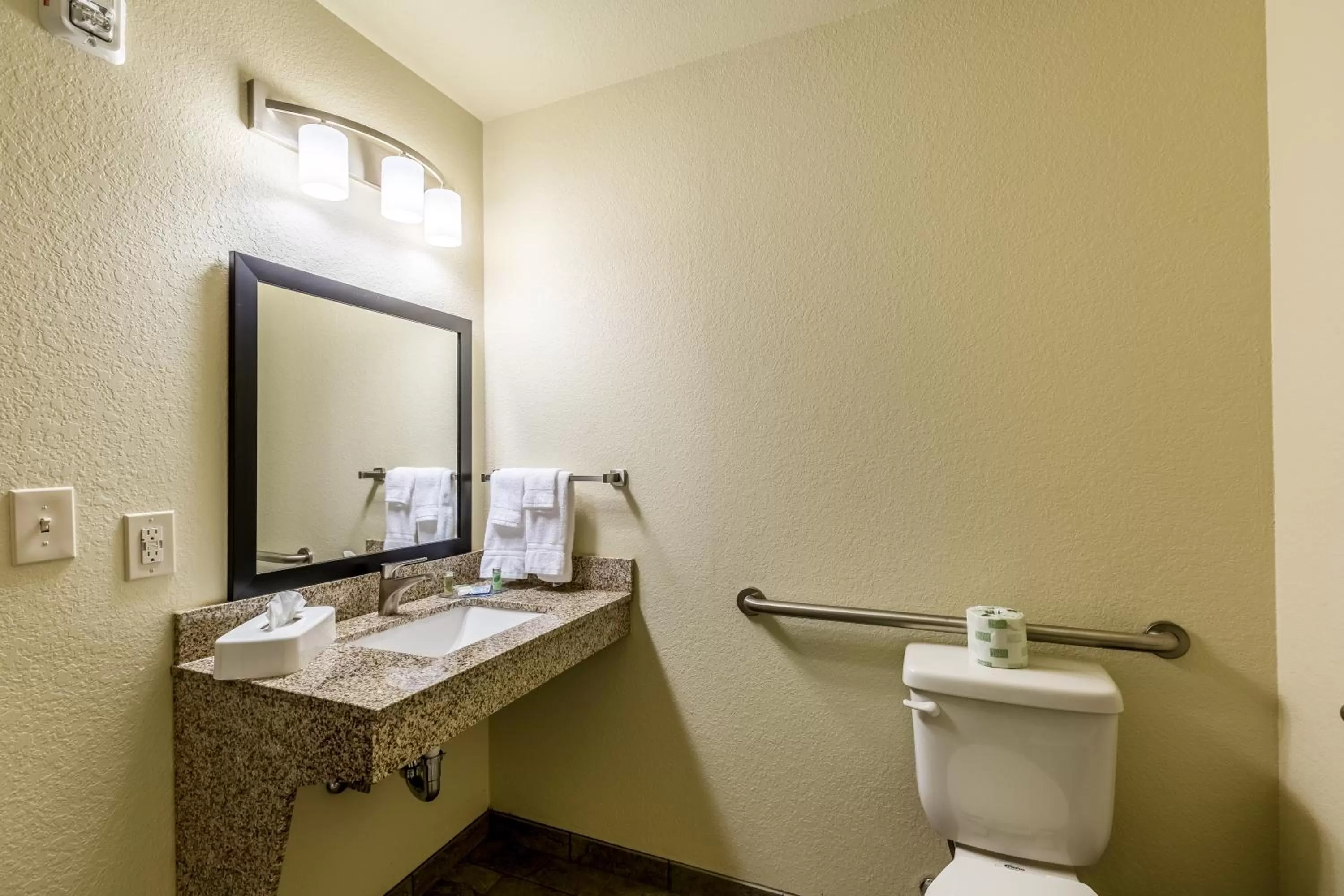 Toilet in Cobblestone Hotel & Suites - Stevens Point