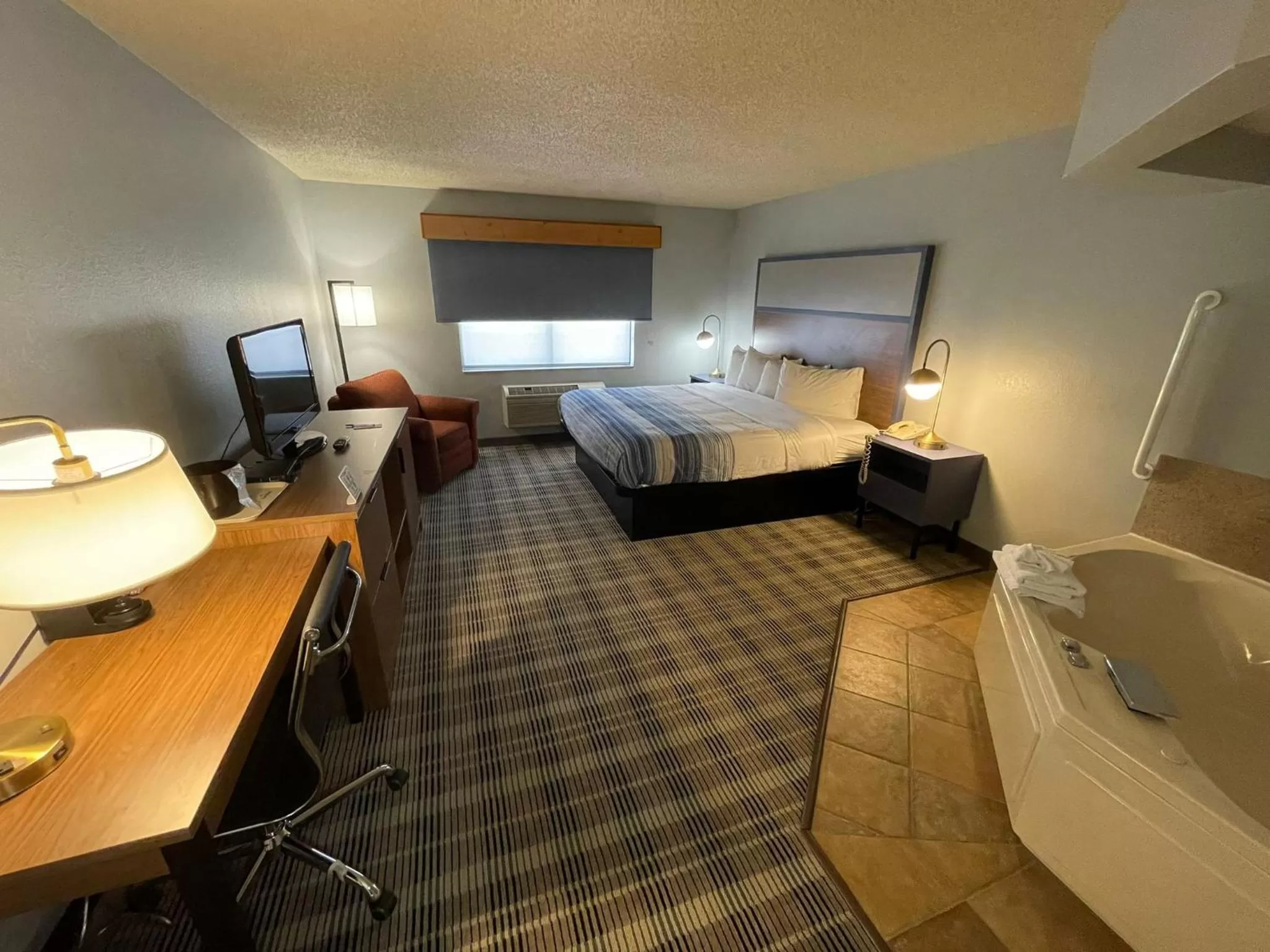 Photo of the whole room, Bed in AmericInn by Wyndham Sayre