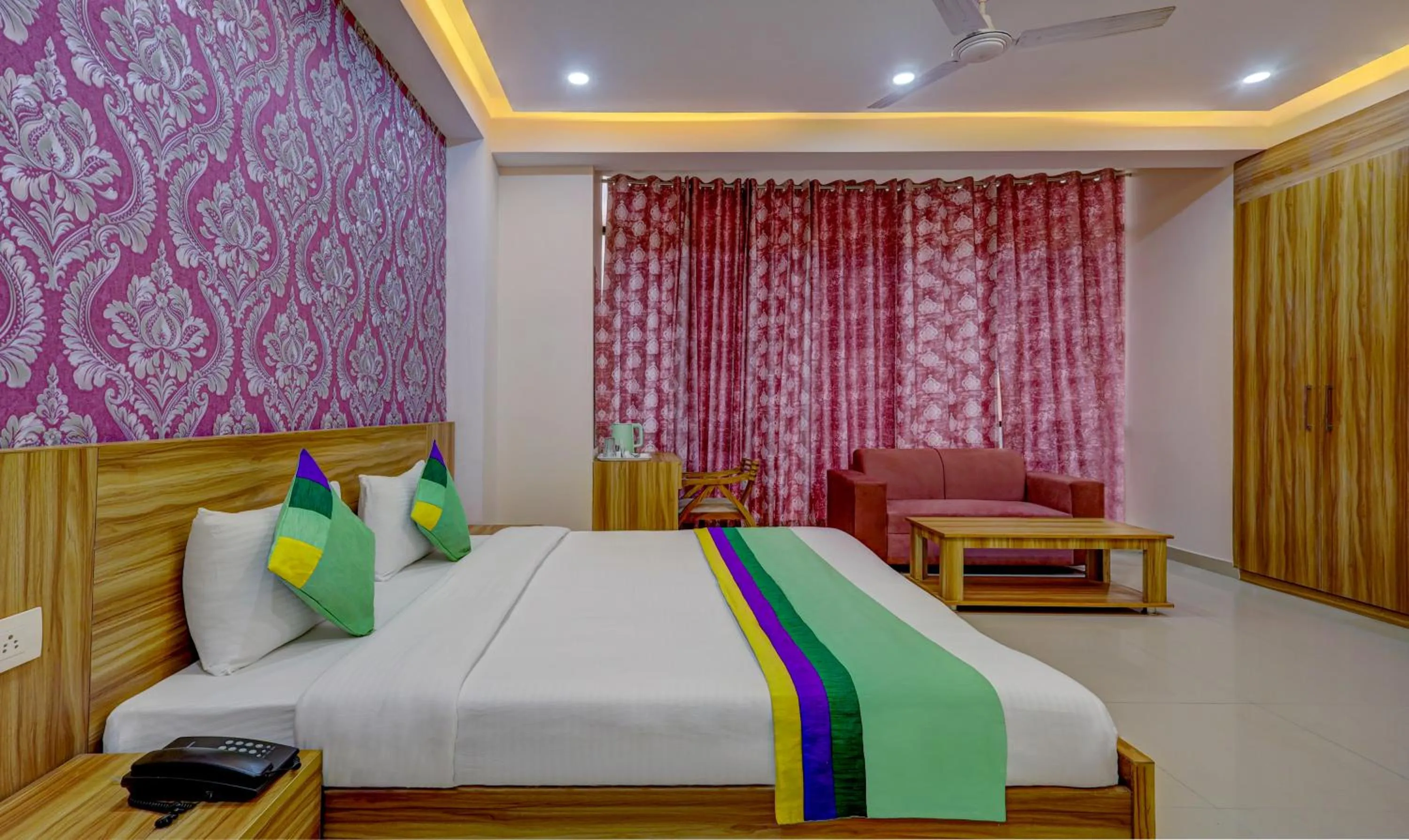 Seating area, Bed in Treebo Primeone