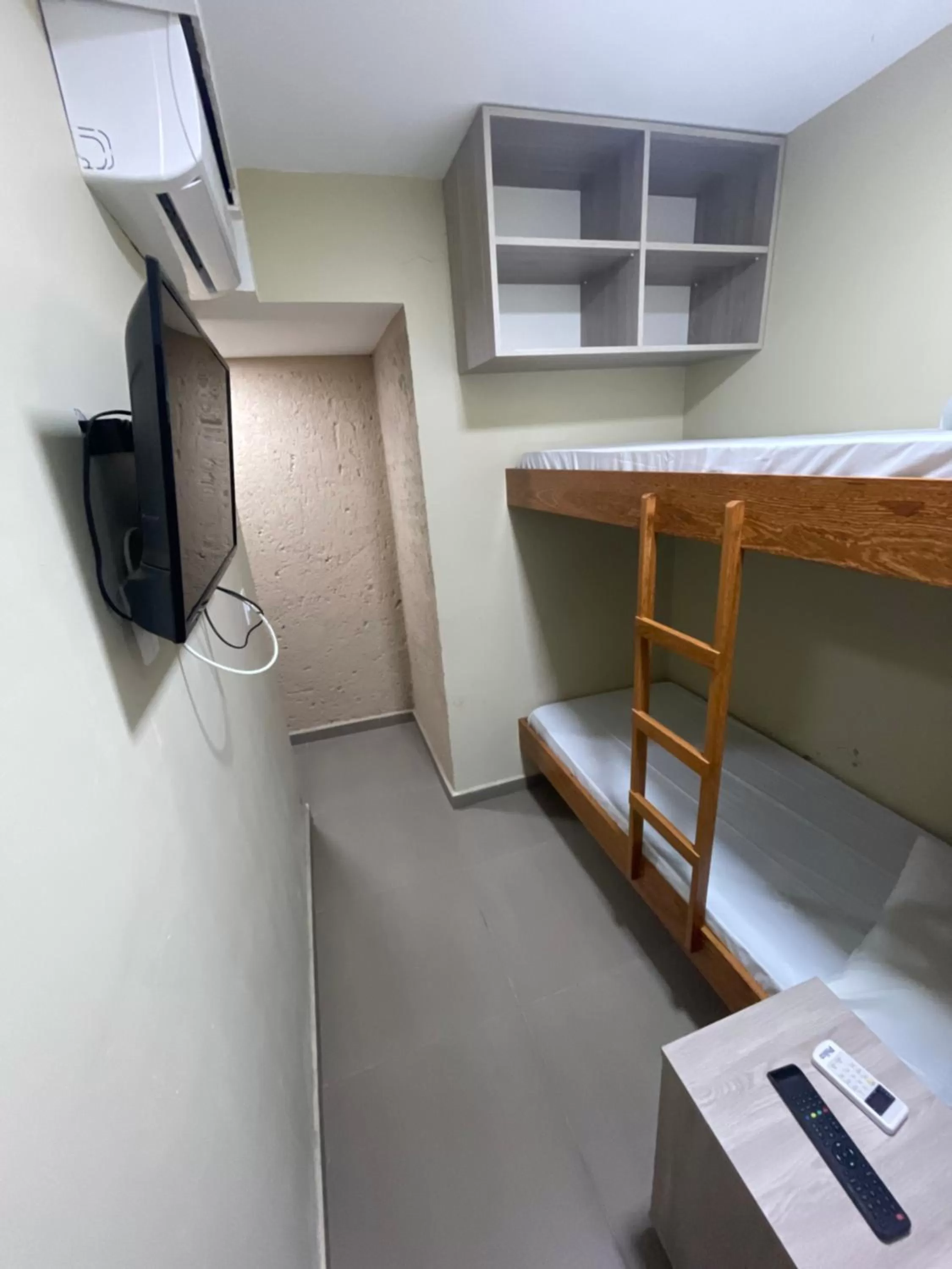 Bed in Pousada Tissiano