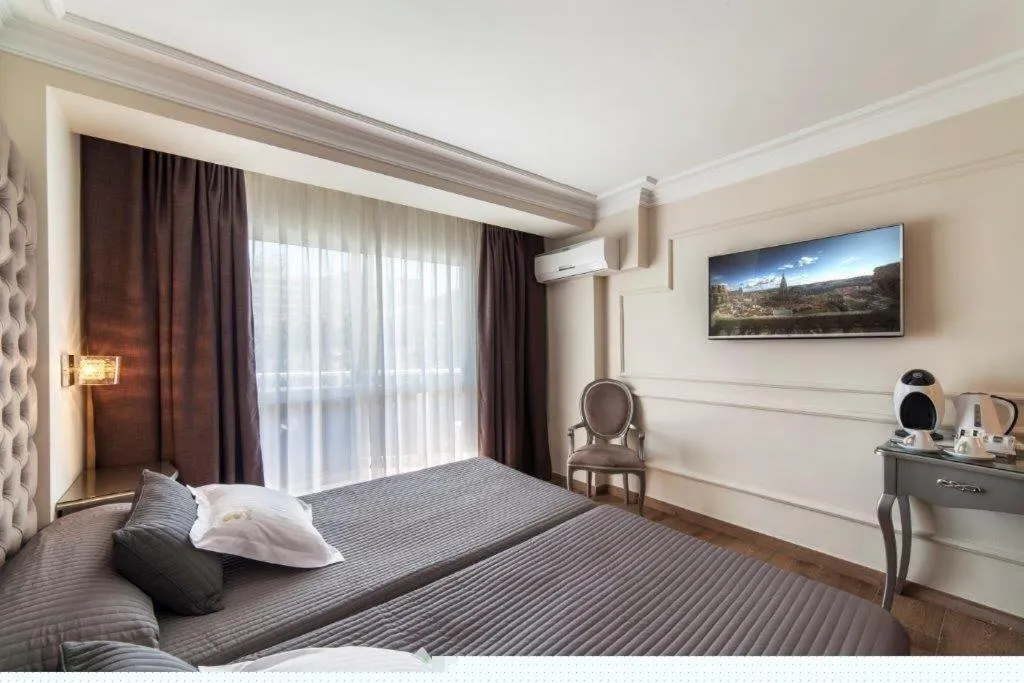 Bed in Essence Hotel Boutique