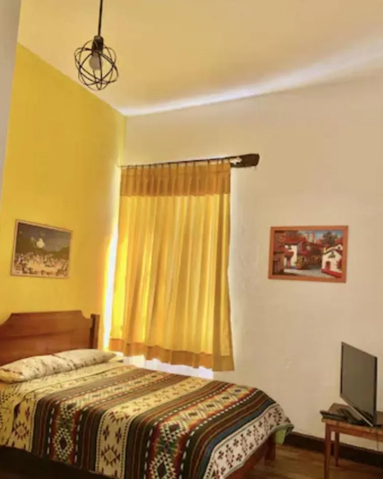 Bed in Blue Door Housing Historic Quito