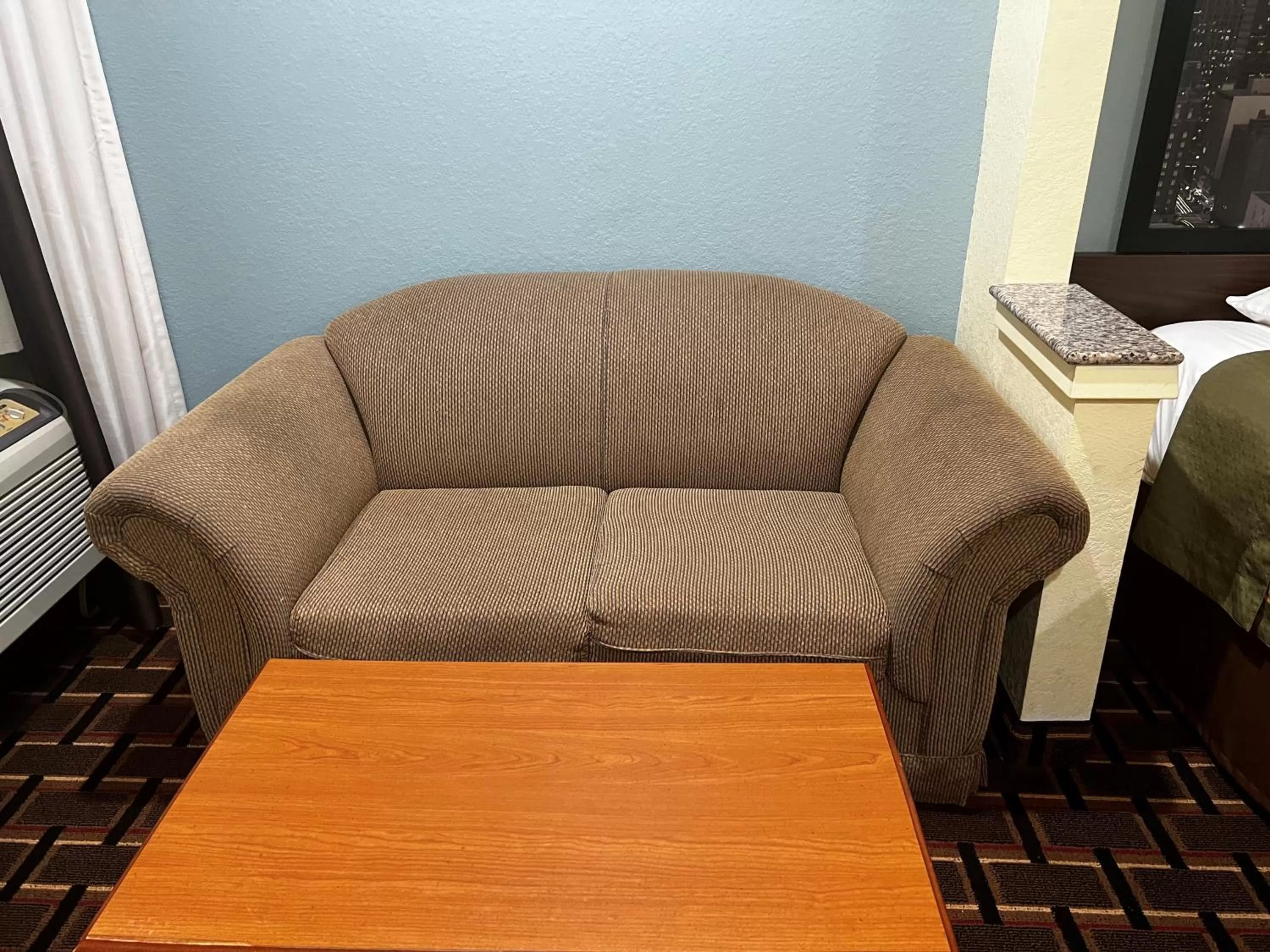 Seating area in Super 8 by Wyndham Stafford Sugarland Area