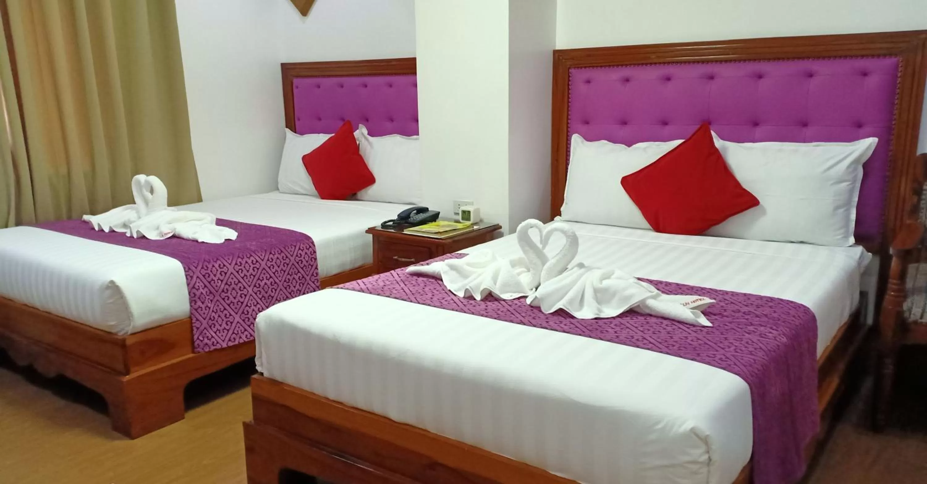 Bed in CLN Boutique Hotel