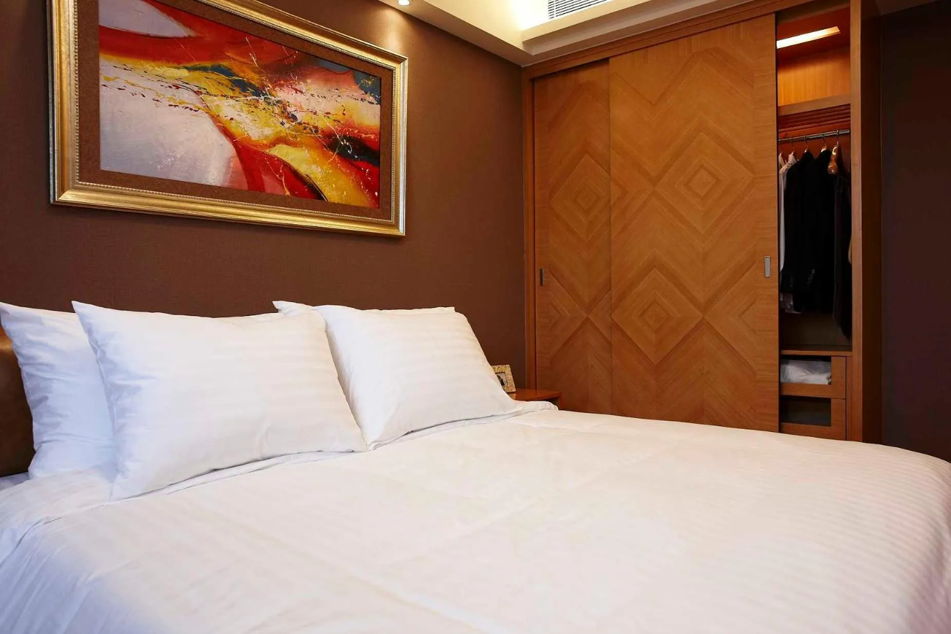 Bed in 广州丹顿行政公寓-Dan Executive Apartment Guangzhou Zhujiang New Town