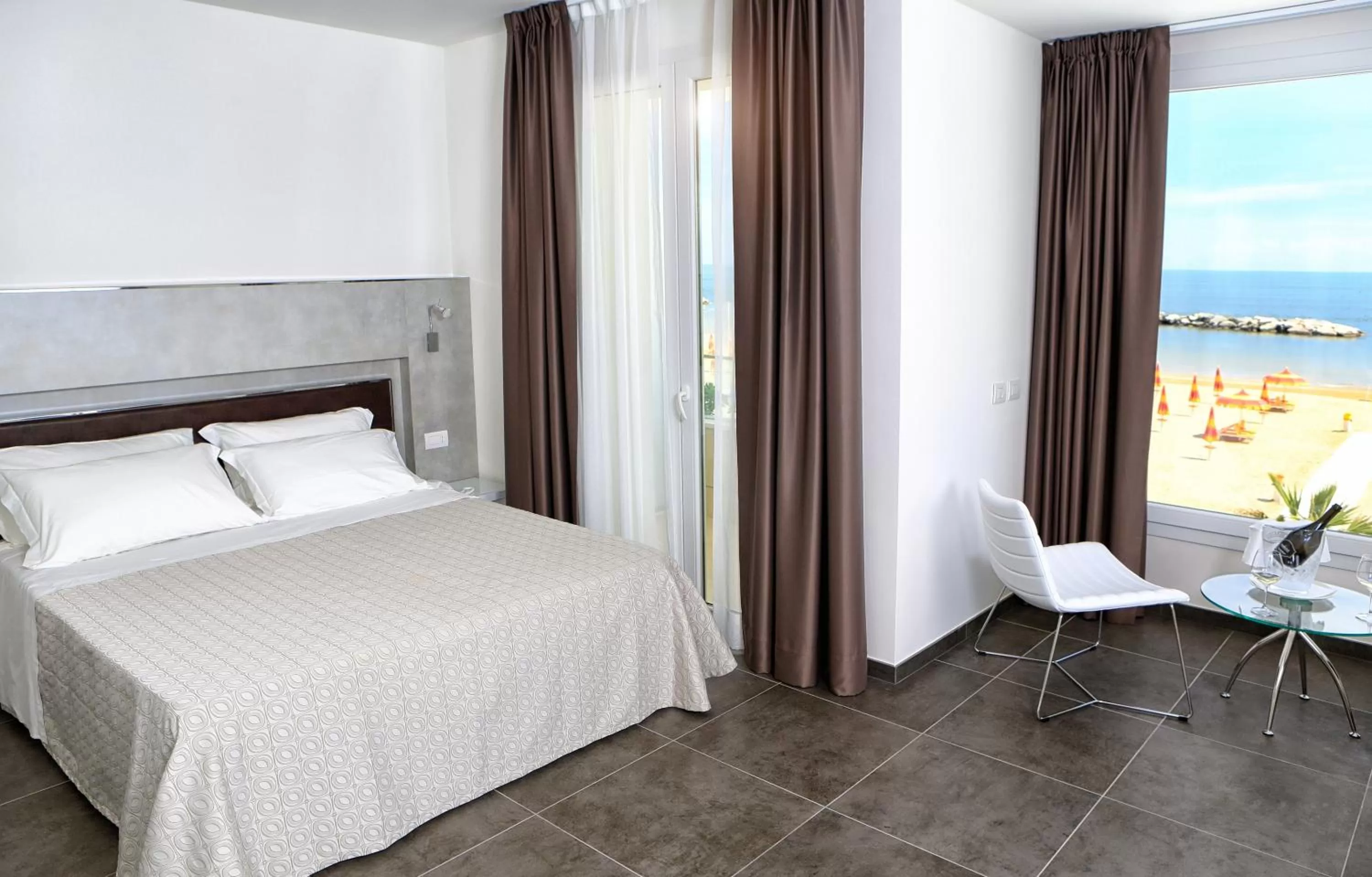 Living room, Bed in Baldinini Hotel