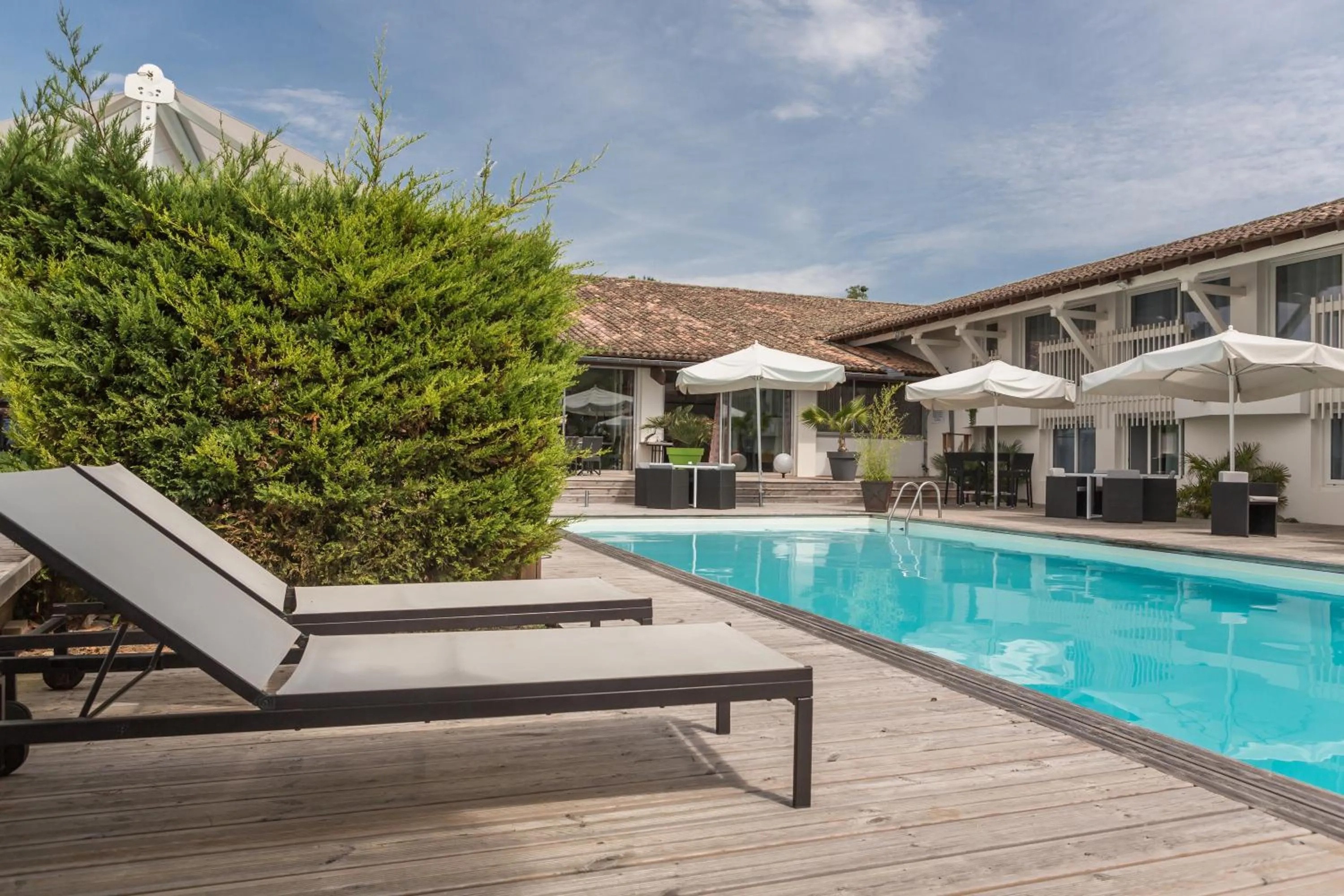 Swimming pool in Logis Hôtel Restaurant La Citadelle