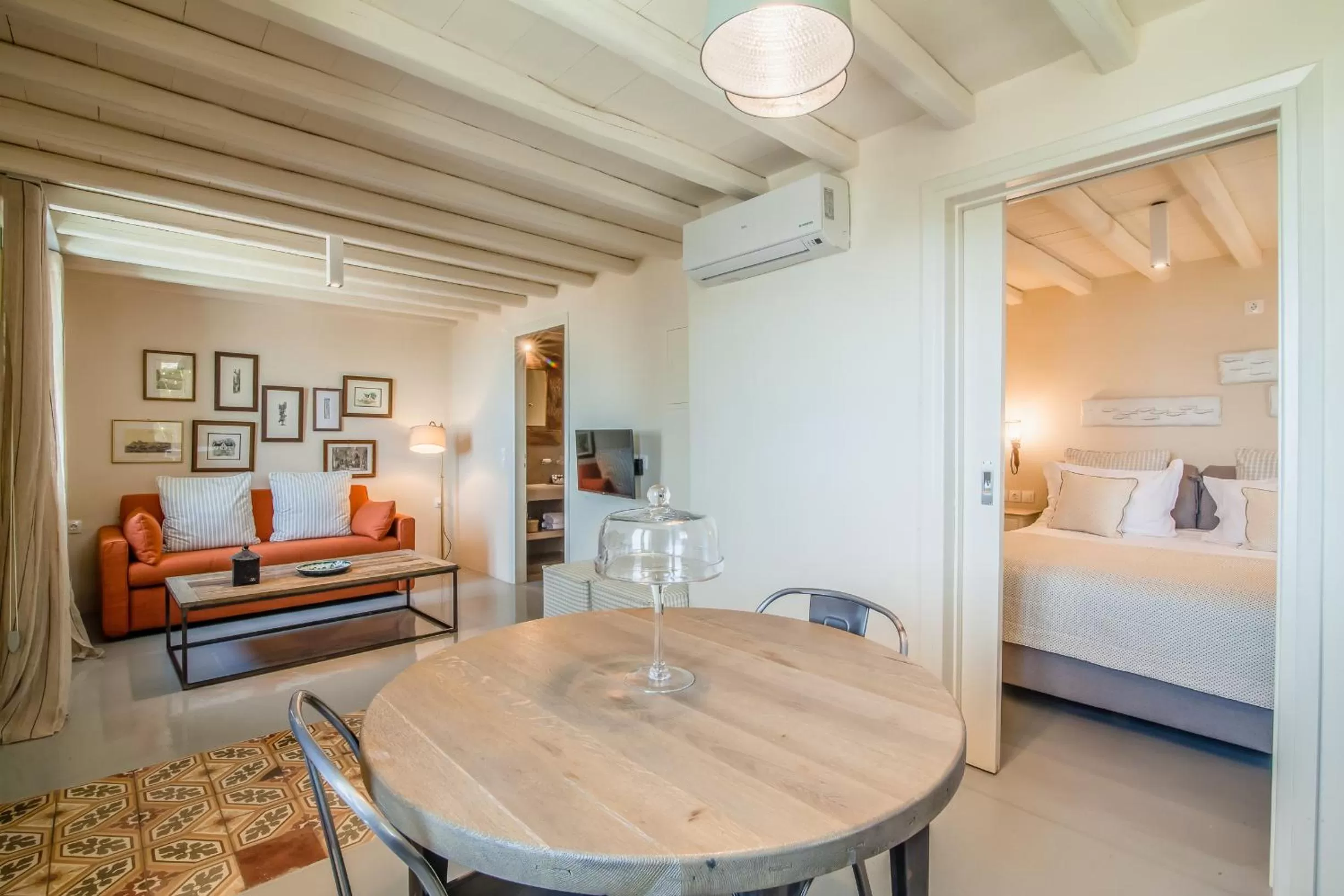Living room, Bed in Aeolis Tinos Suites