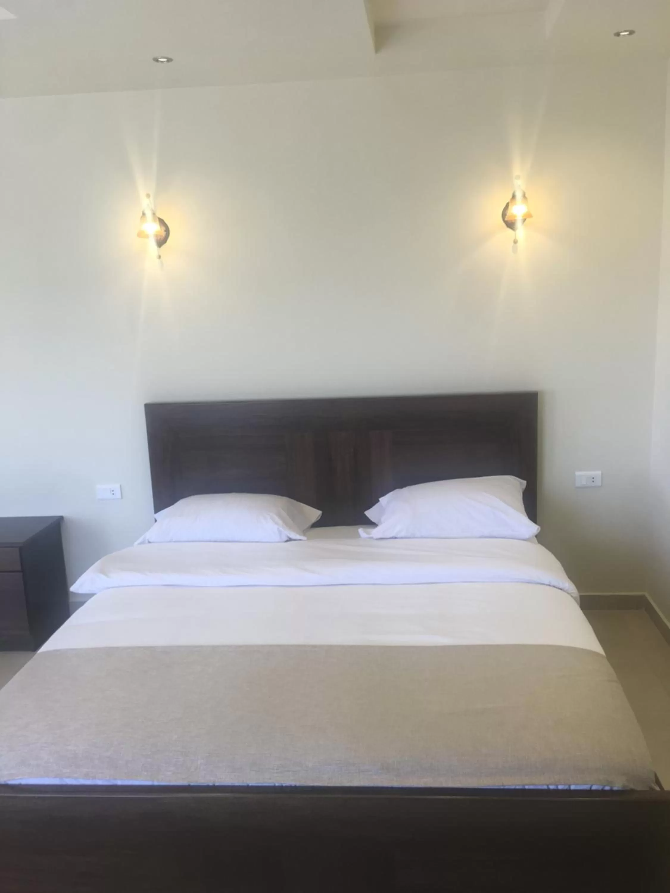 Bed in Hotel L'Aiglon