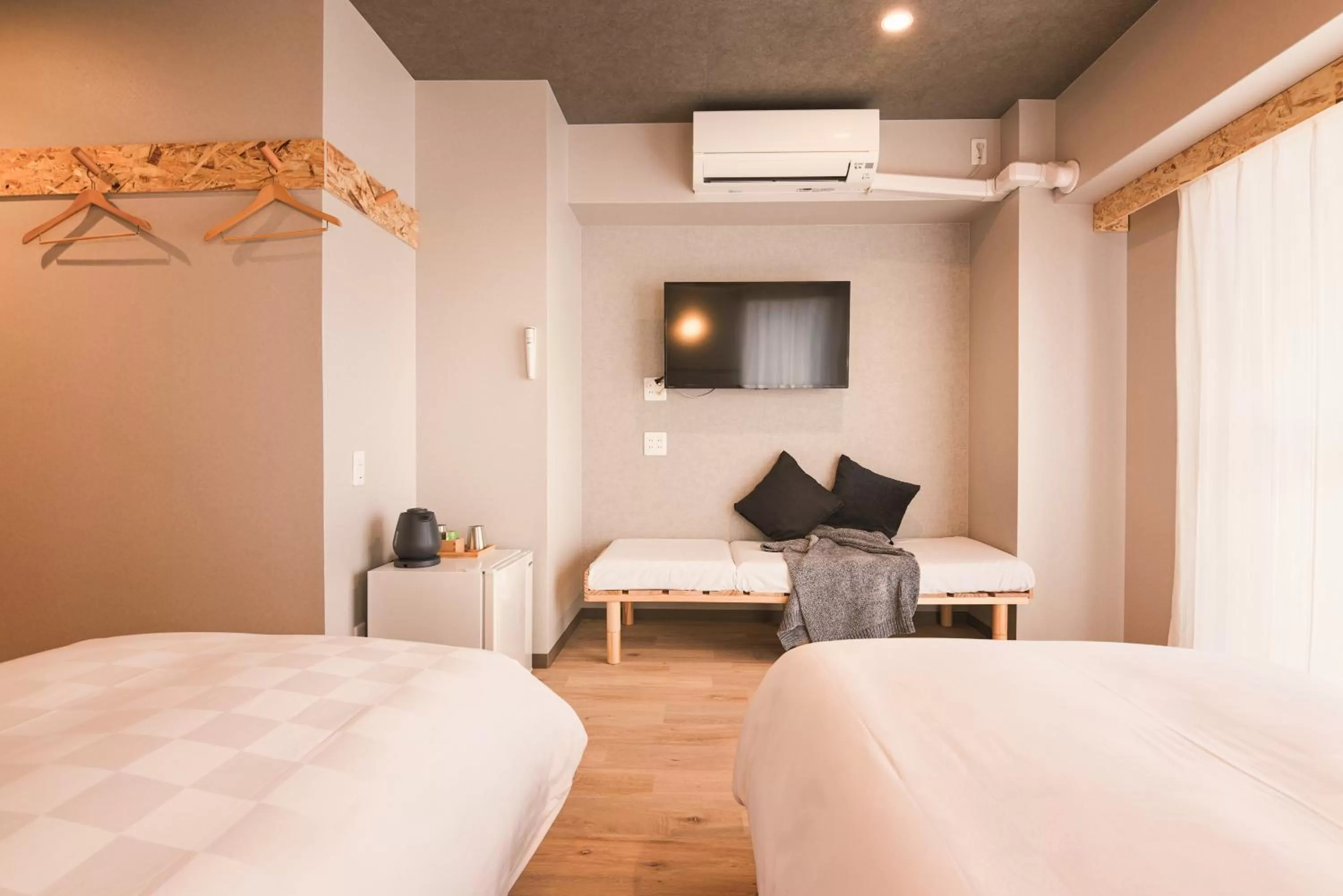 Bed in WAYFARER Kyoto Shijo