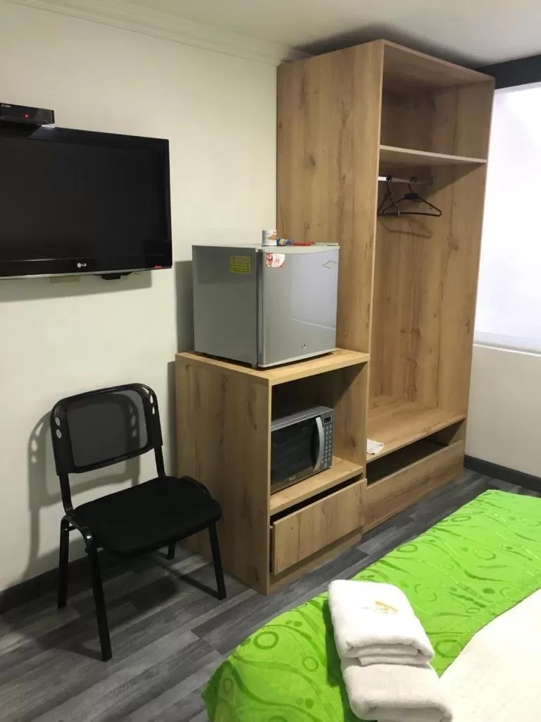 Communal lounge/ TV room, TV/Entertainment Center in Hotel Fénix Real Bogotá