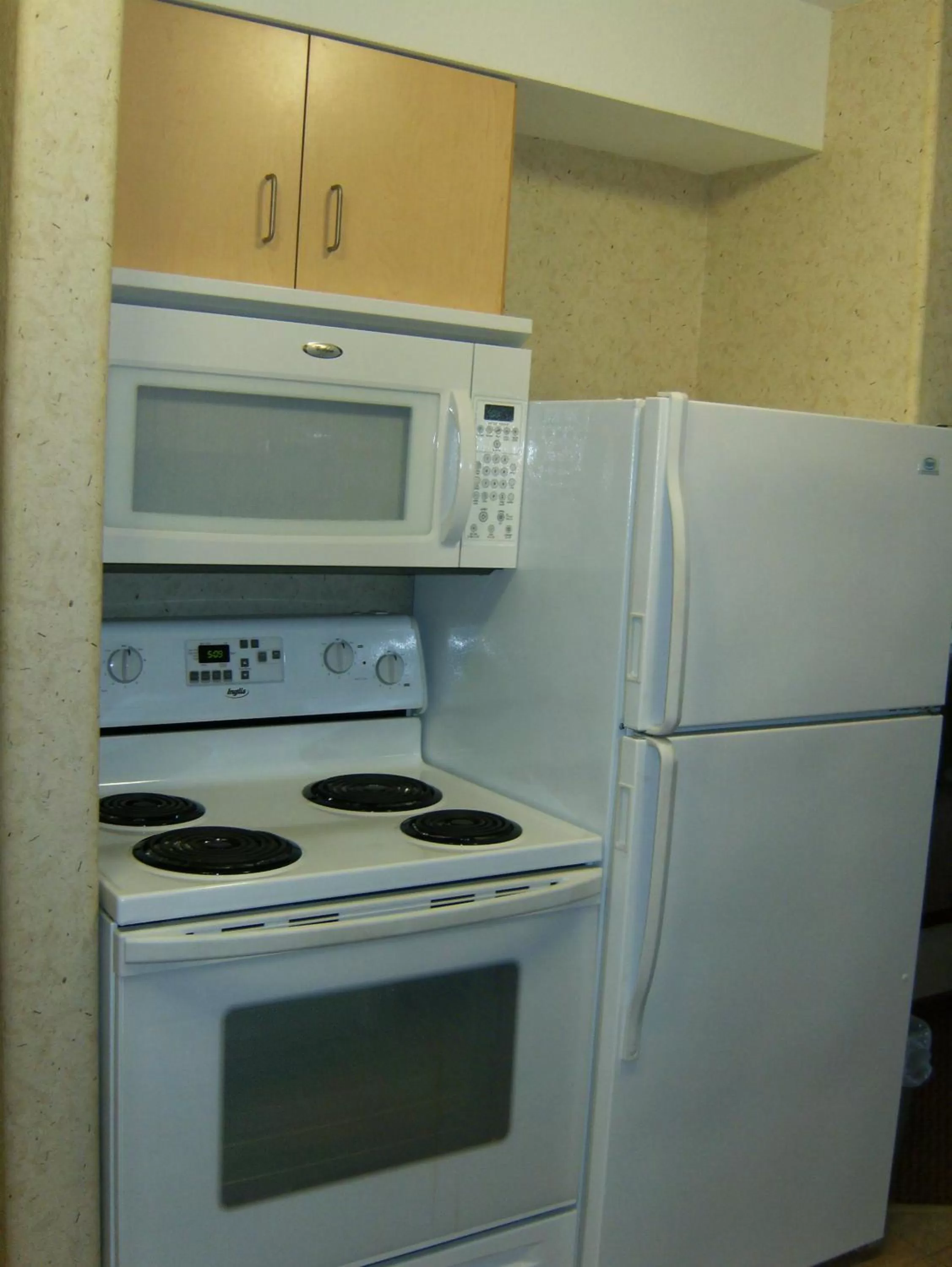 Kitchen or kitchenette in Super 8 by Wyndham Grande Prairie