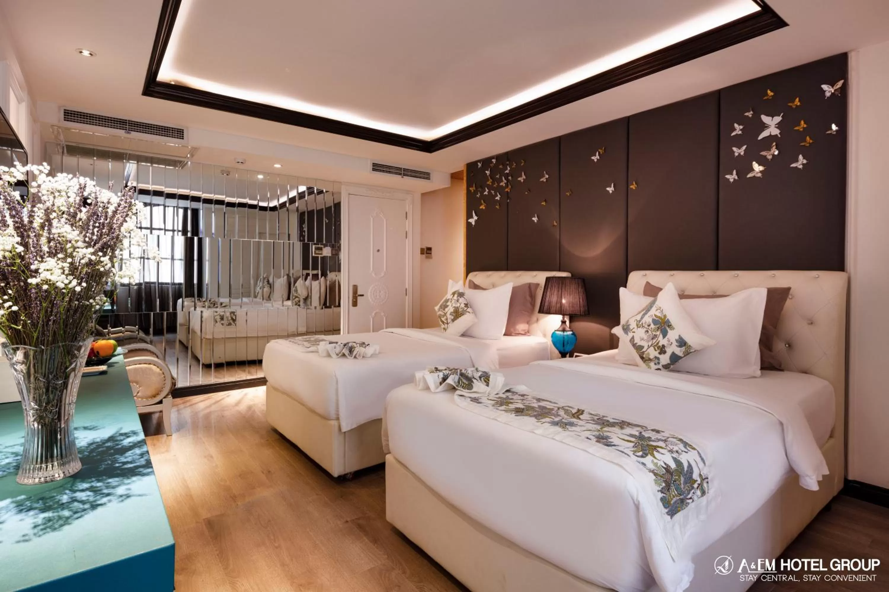 Bed in A&EM Saigon Hotel