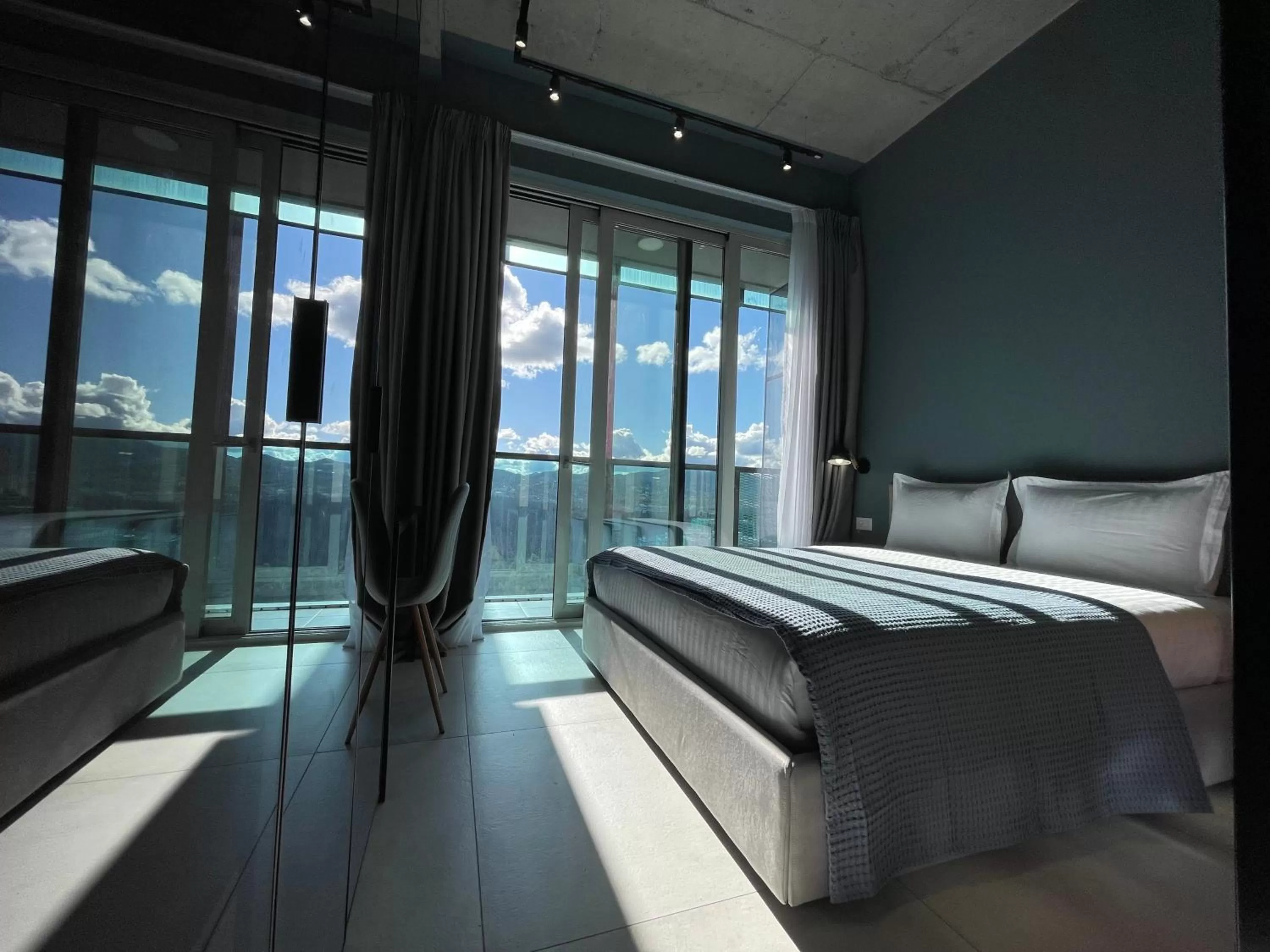 Bed, Seating Area in Ambassador Skyline Apartments