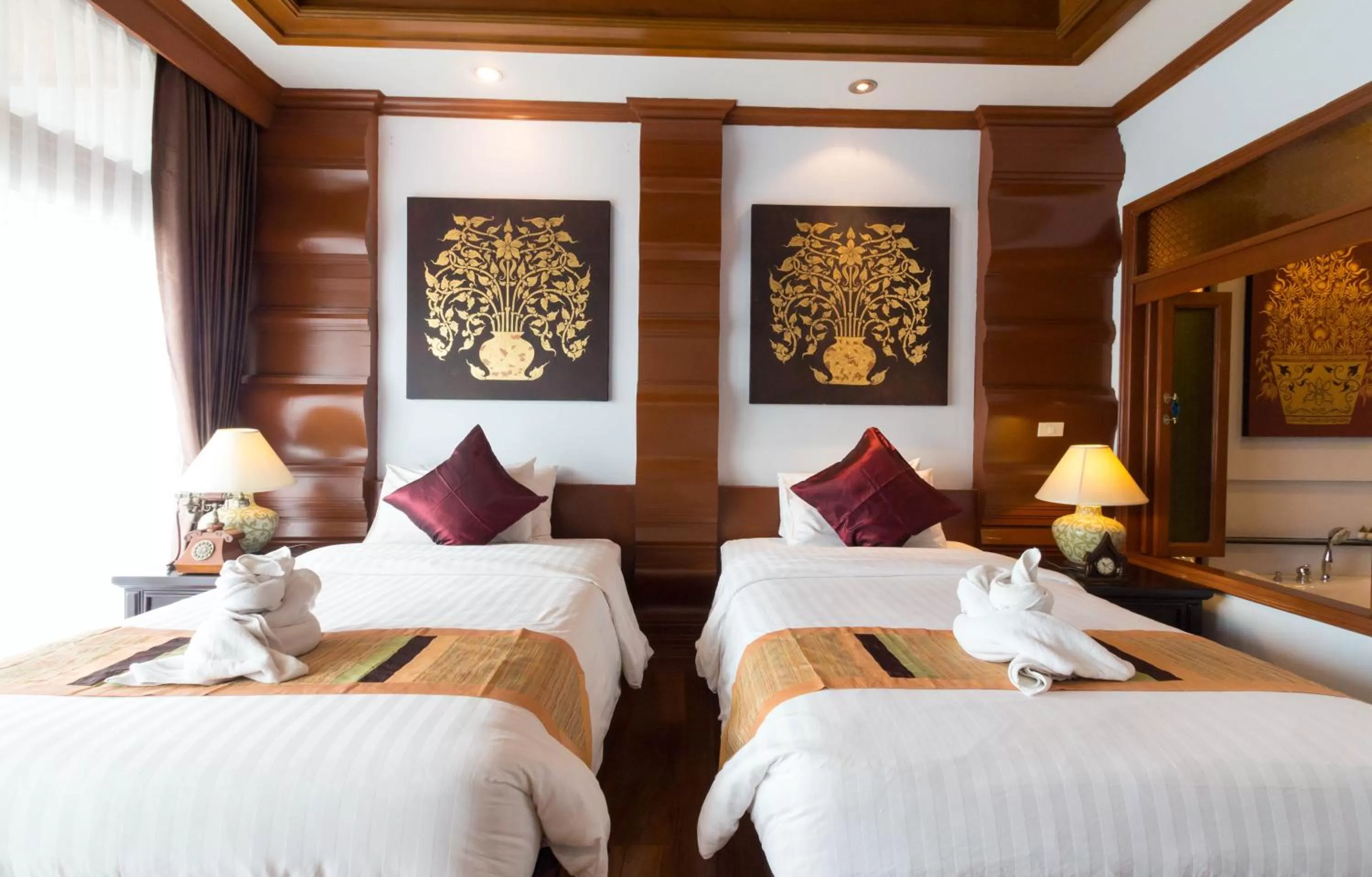 Bed in Sunday Villa Sirilanna Hotel