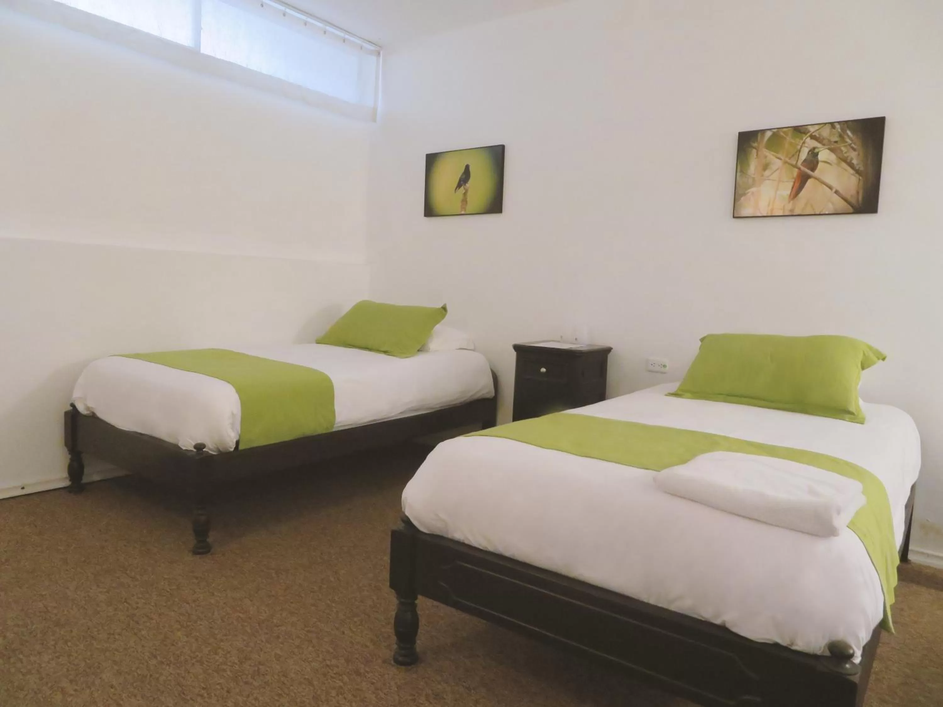 Bed in Bird Garden Guest House