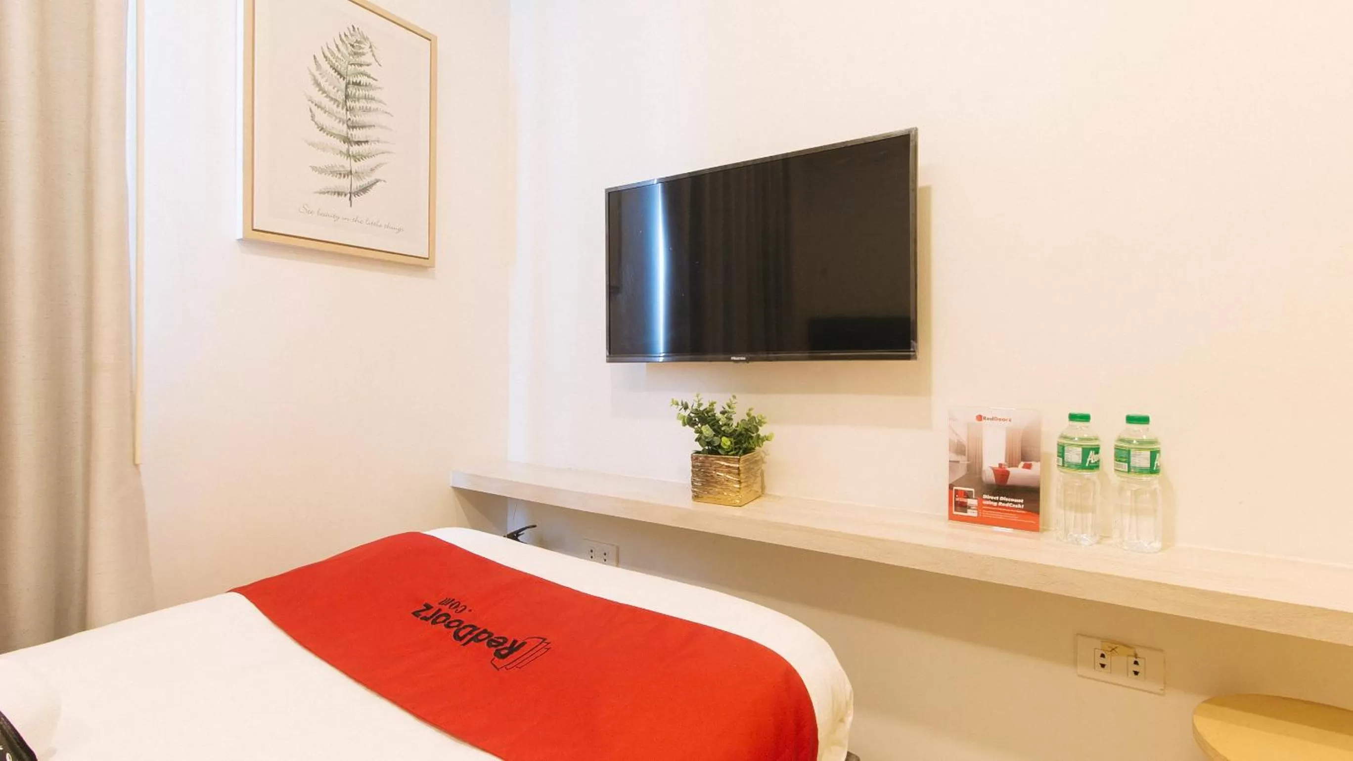 TV and multimedia, Bed in RedDoorz Plus at La Belle Residences Makati City