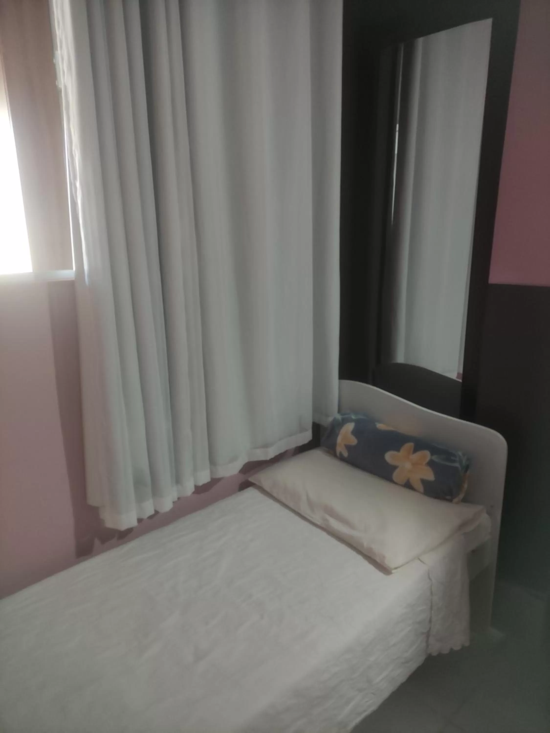 Bed in Pousada da Gi Suítes e Turismo