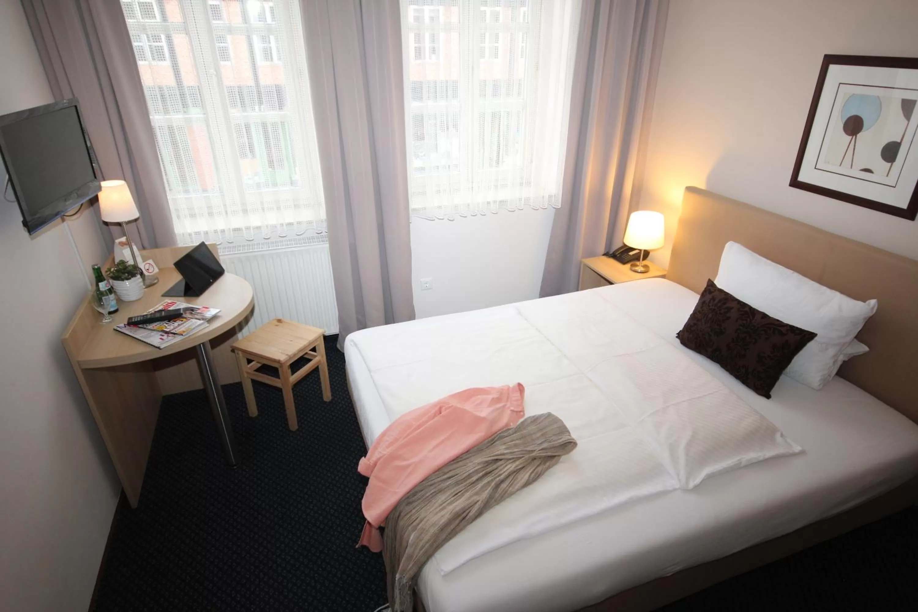 Bed in ONNO Boutique Hotel & Apartments