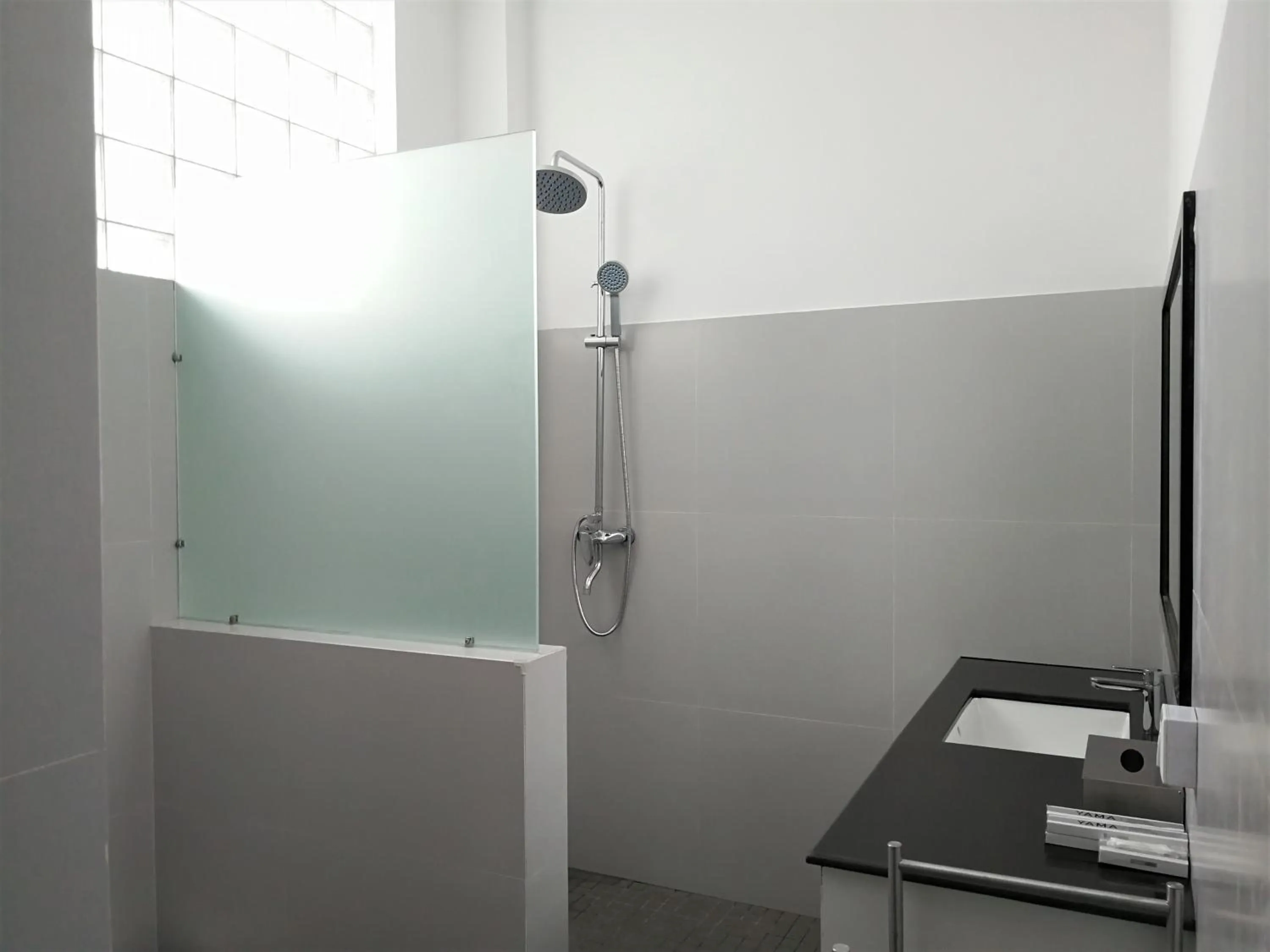 Shower in YAMA HOTEL & ROOFTOP BAR