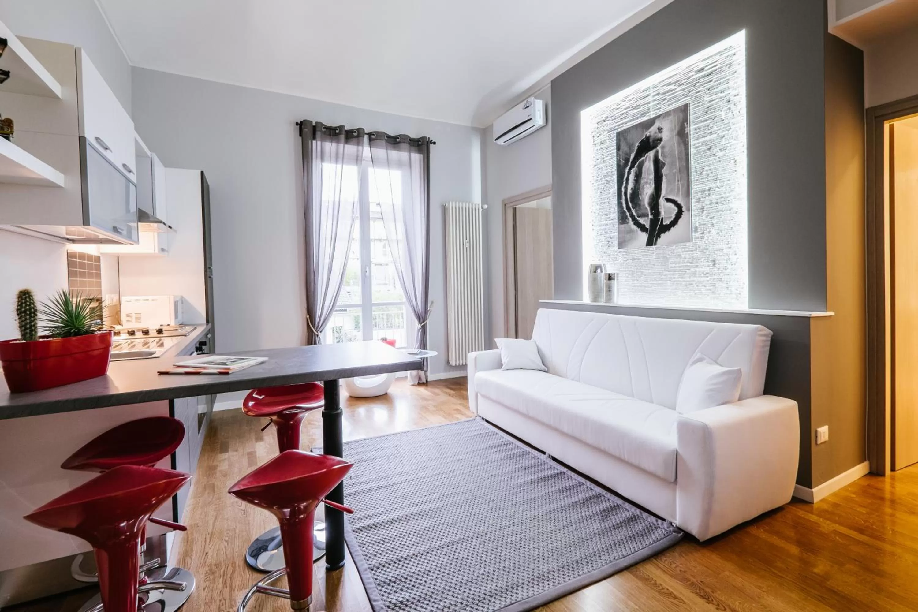 Seating area, Bed in Apart Hotel Torino