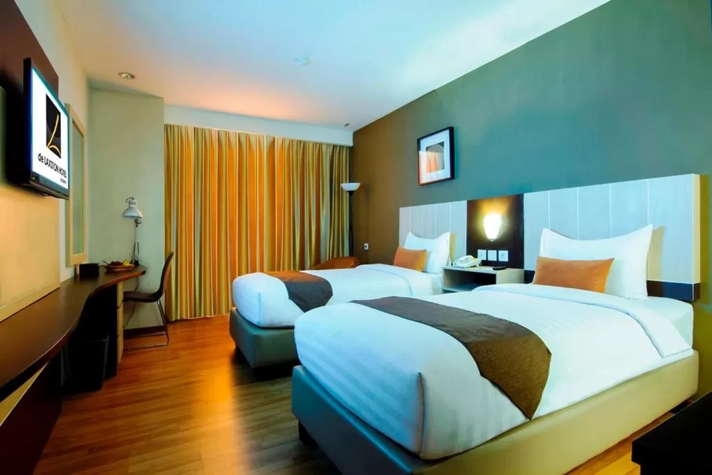 Bed in De Laxston Hotel Yogyakarta, Azana Hotels Collection