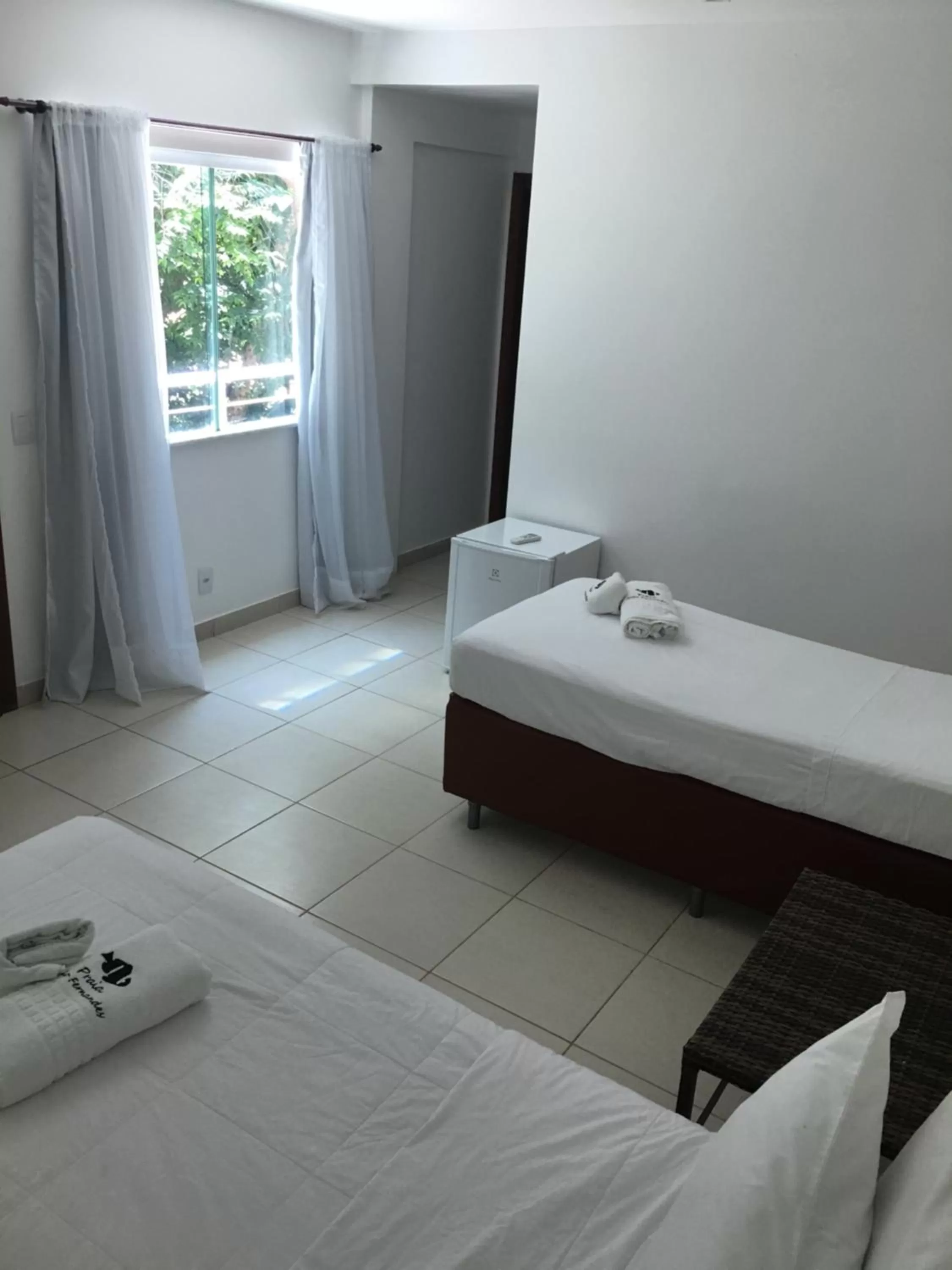 Bed in Pousada Praia João Fernandes