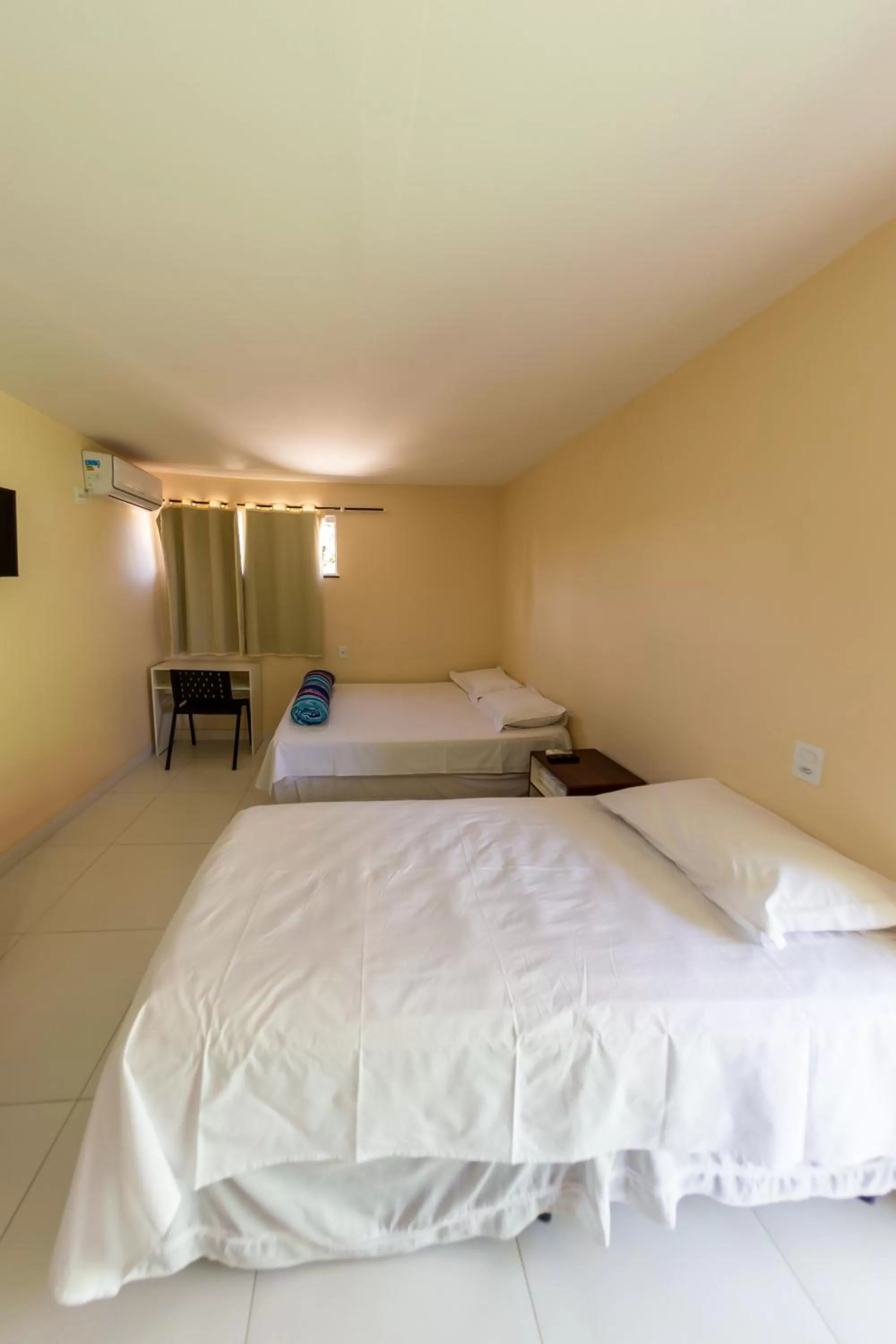 Bed in Pousada Jardim Brasília