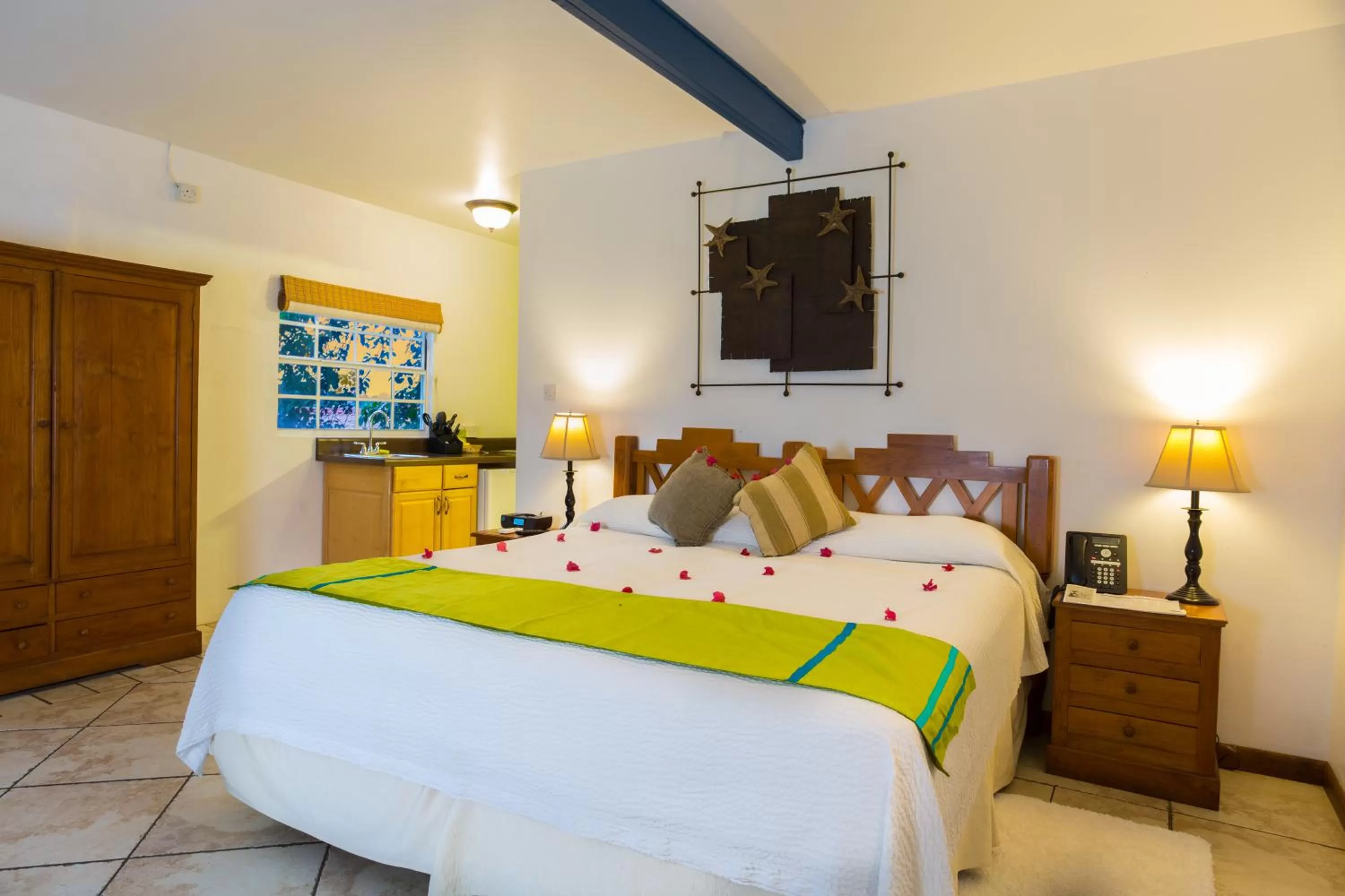 Photo of the whole room, Bed in True Blue Bay Resort