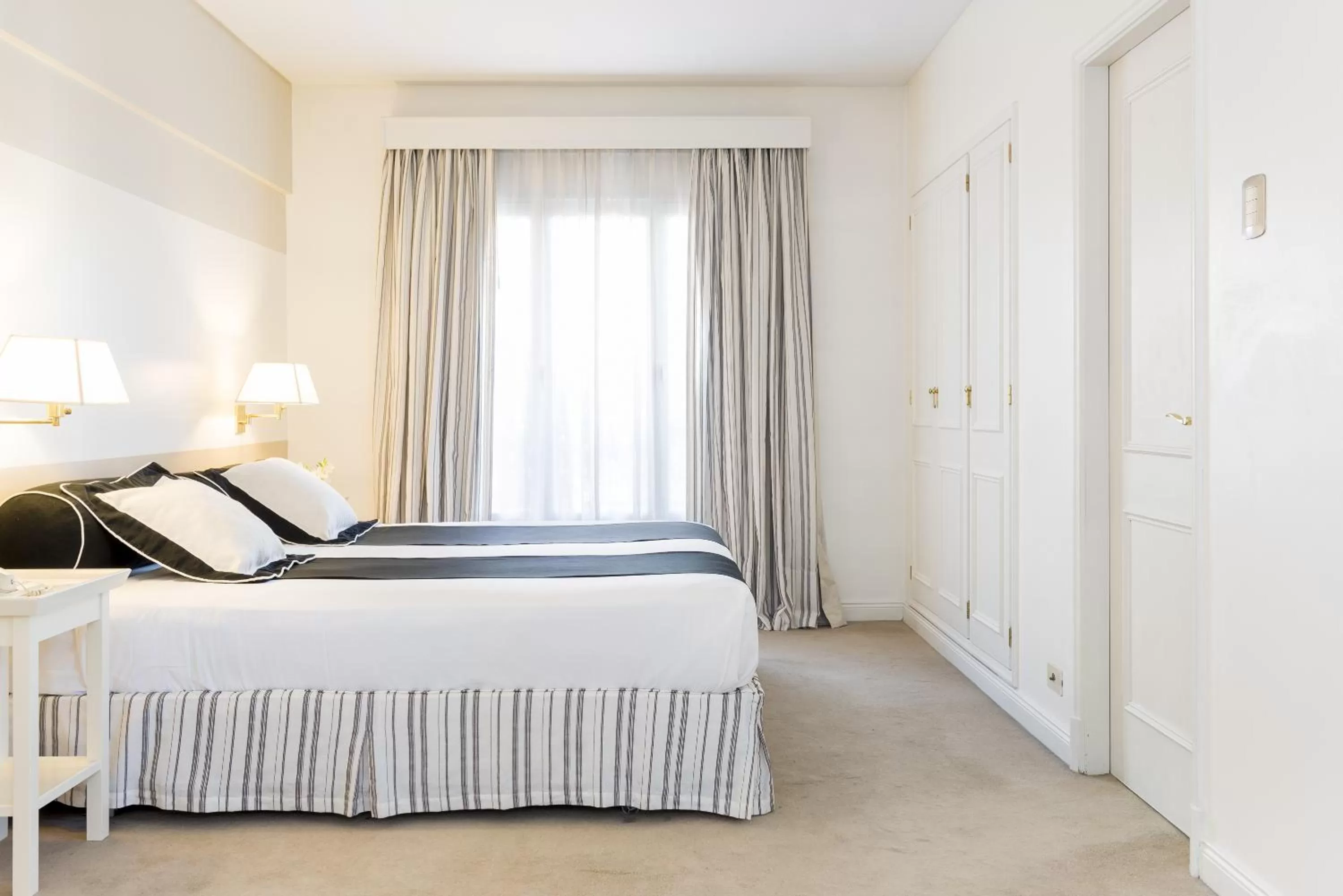 Bed in Loi Suites Recoleta Hotel