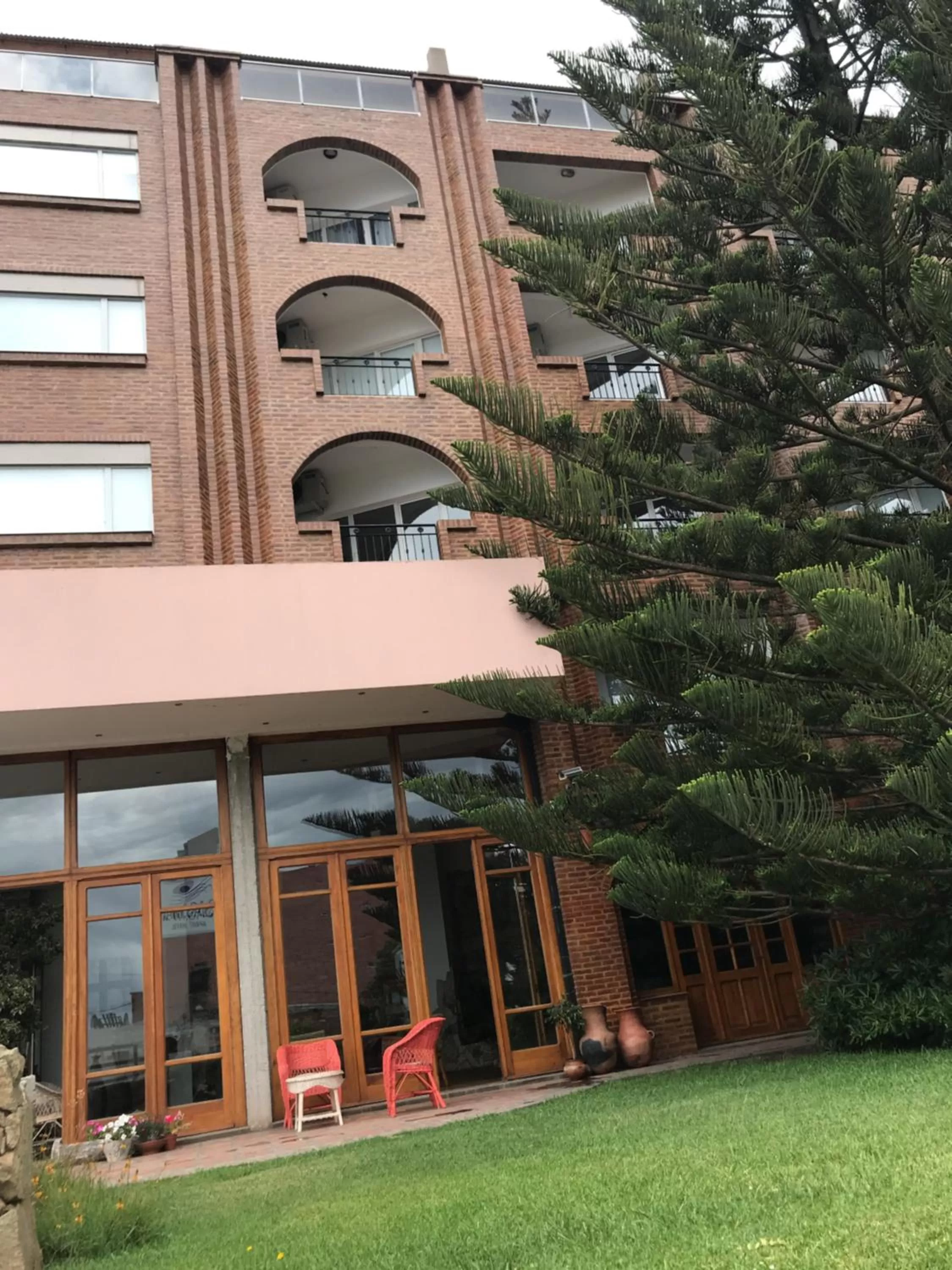 Patio, Property Building in Costanera Mar Hotel & Suites