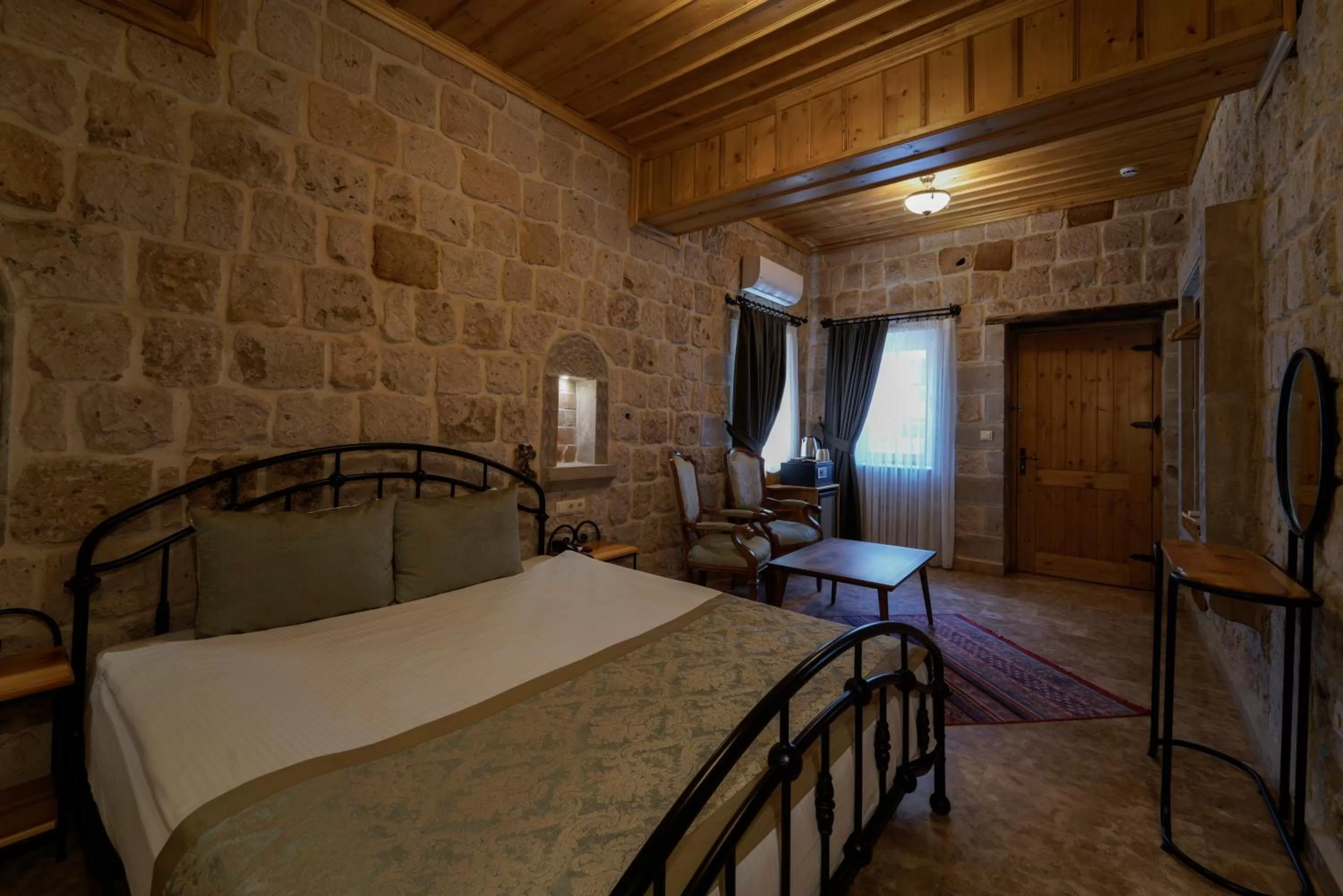 Seating area, Bed in Cratus Stone Palace