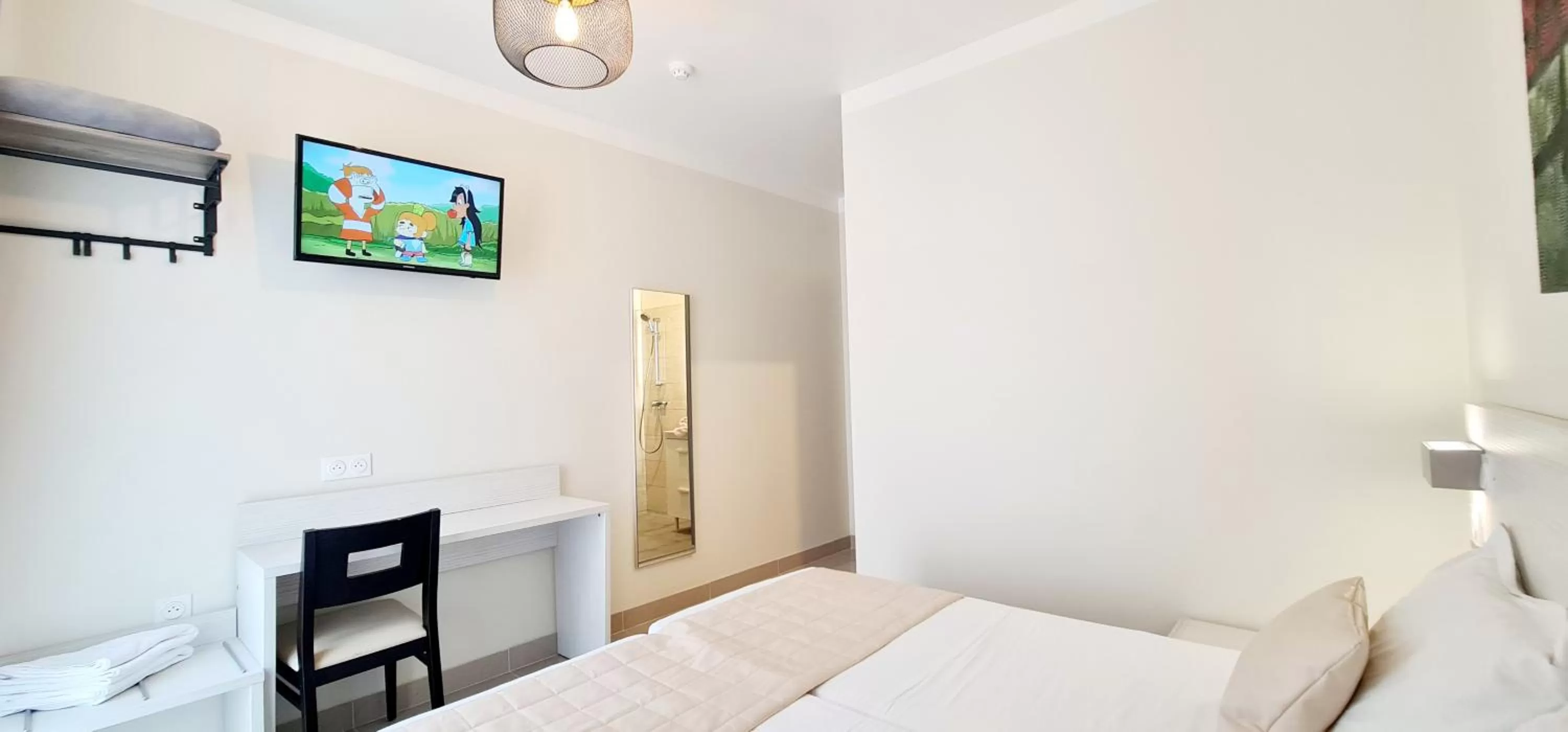 Bed in ESPERANCE HOTEL