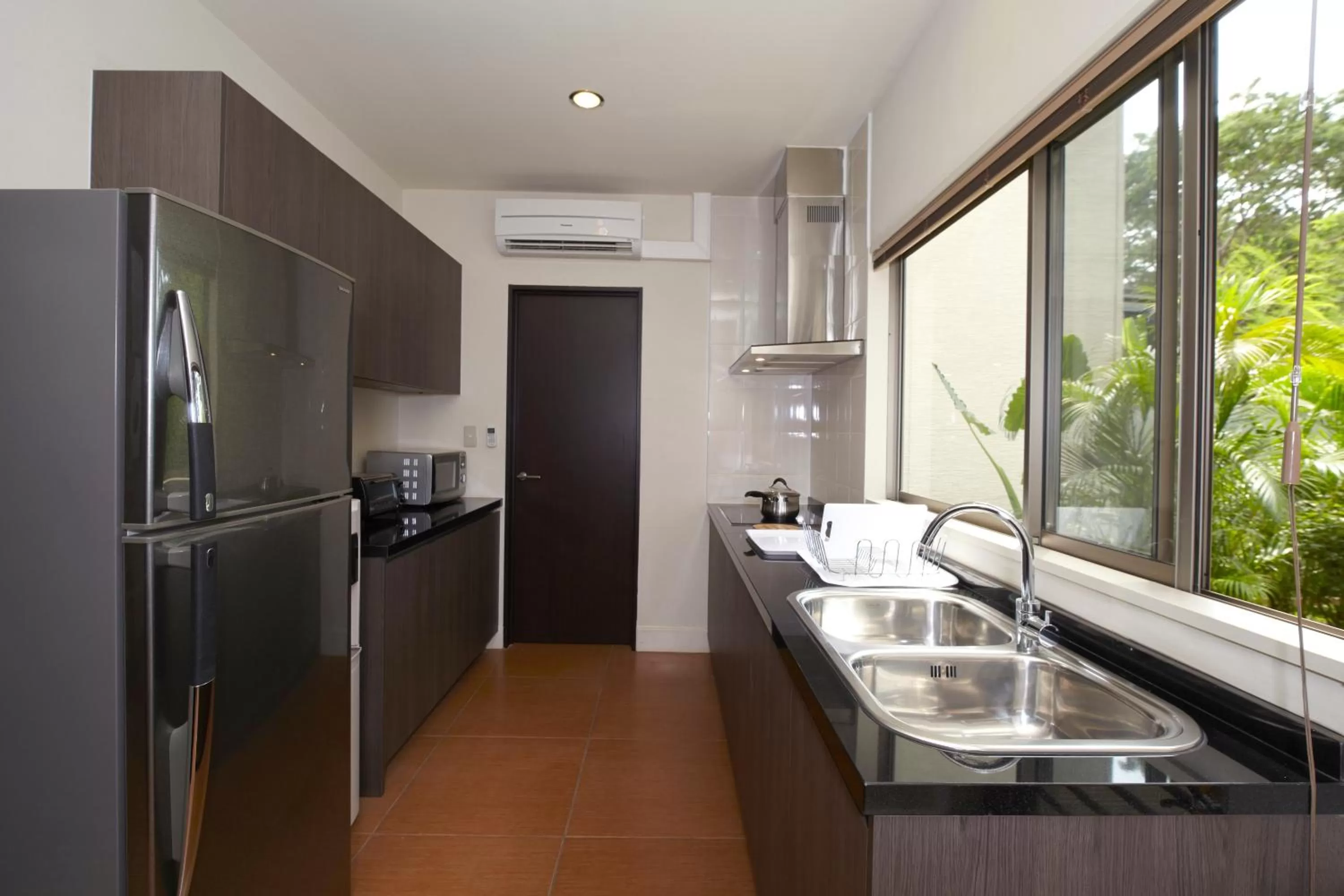 Kitchen or kitchenette in Axia South Cikarang Service Apartment