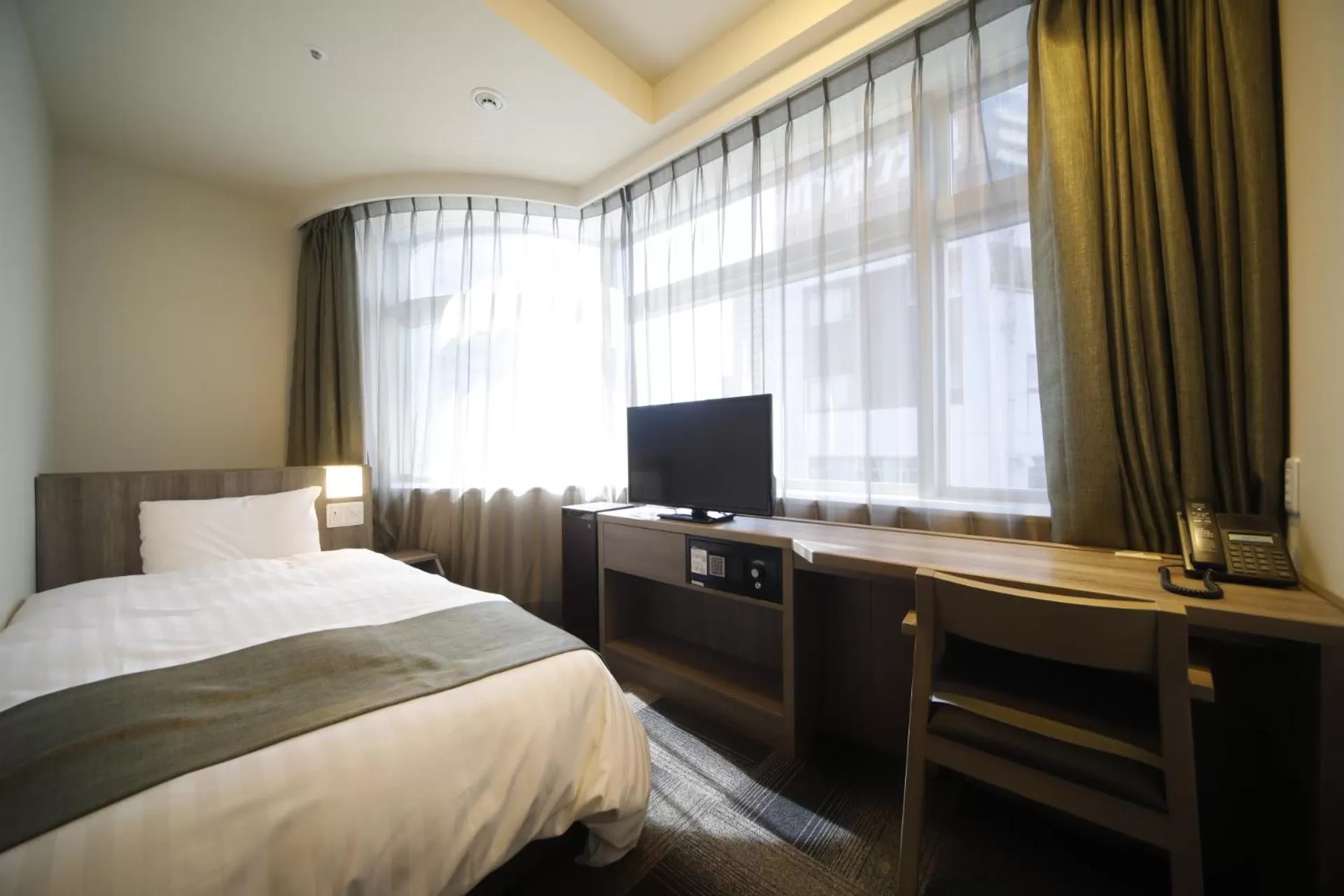 Bed in Dormy Inn Korakuen