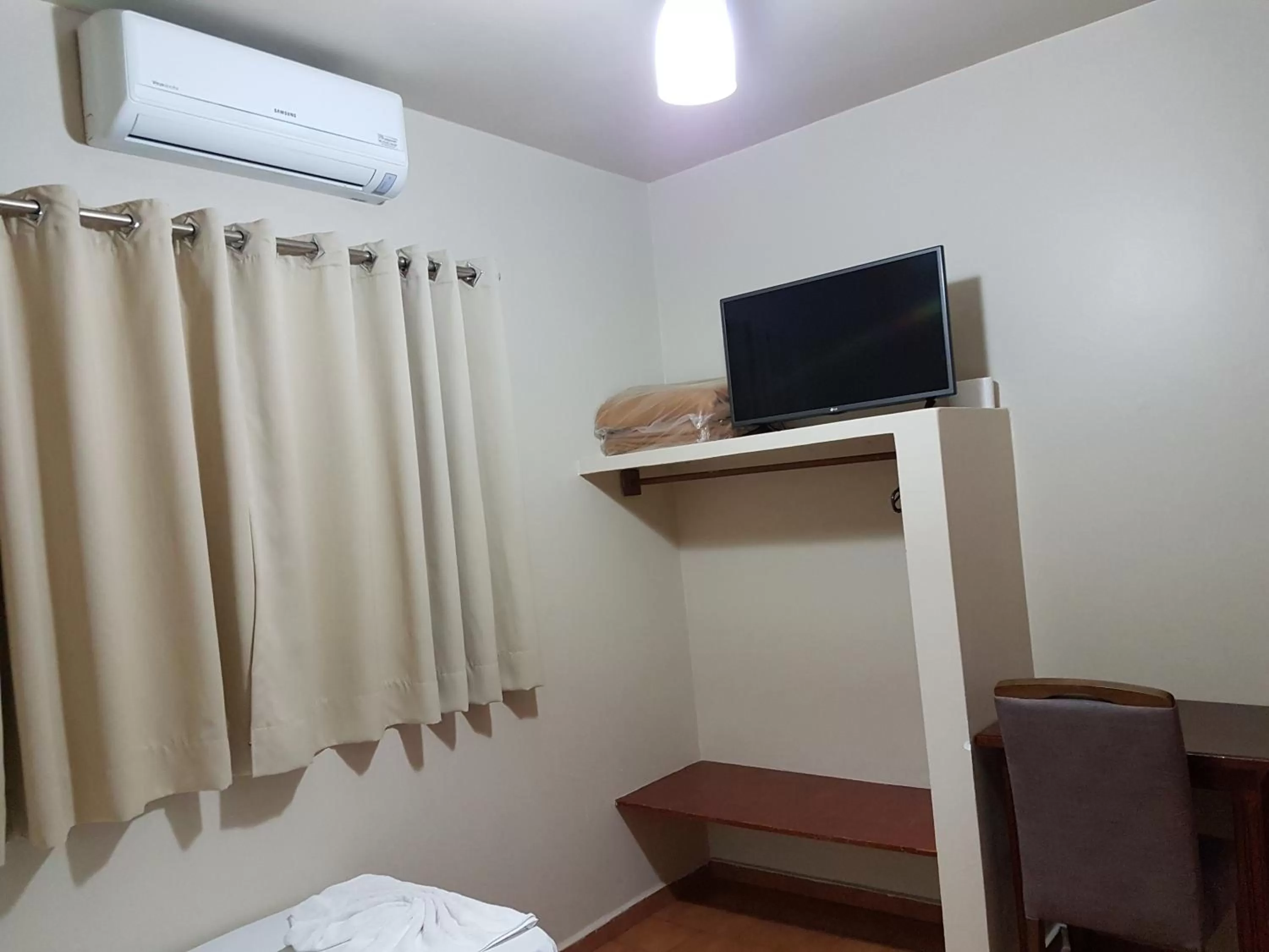 TV/Entertainment Center in Hotel Barretos